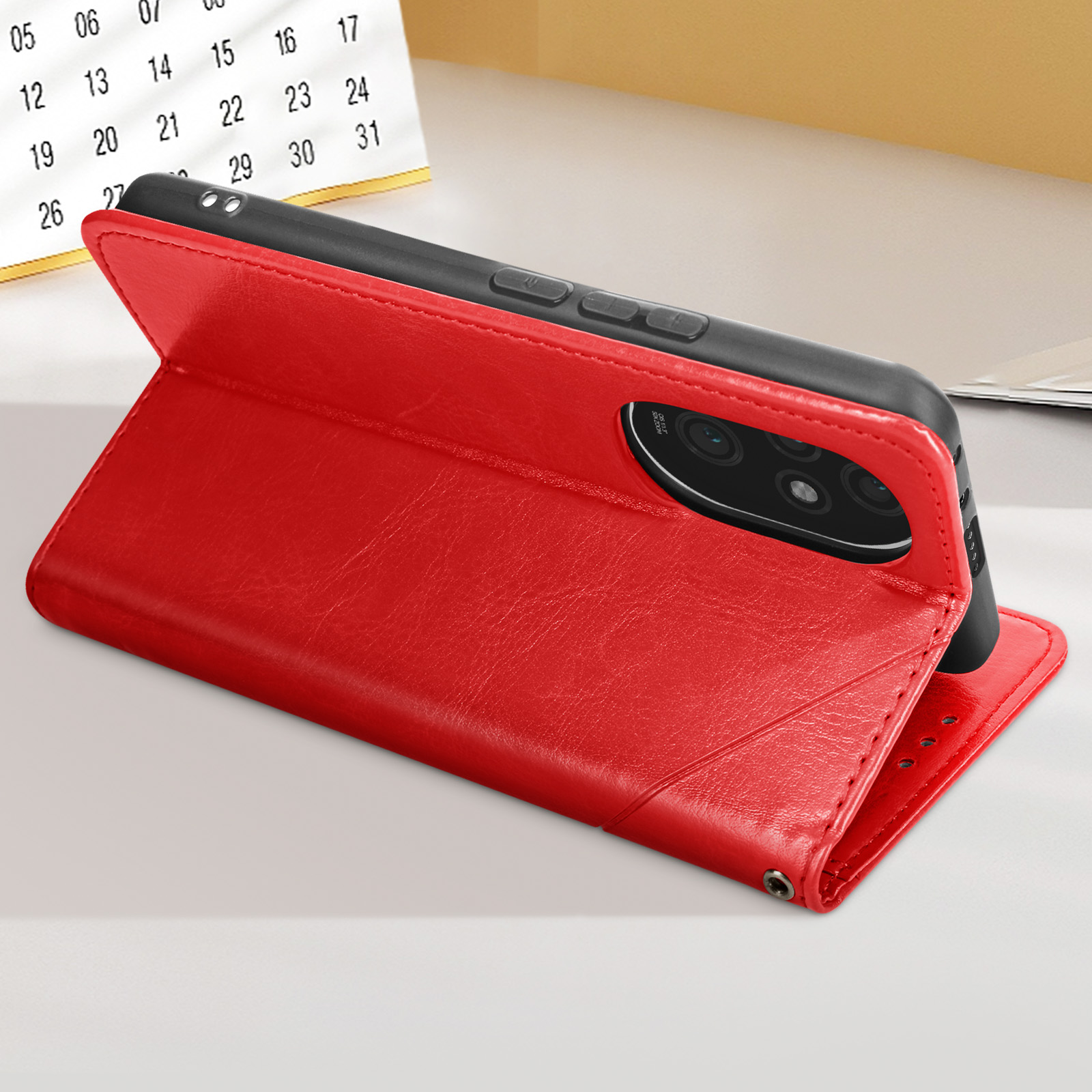 Custodia per telefono rossa, aperta con il telefono sollevato. Un calendario è visibile sullo sfondo.