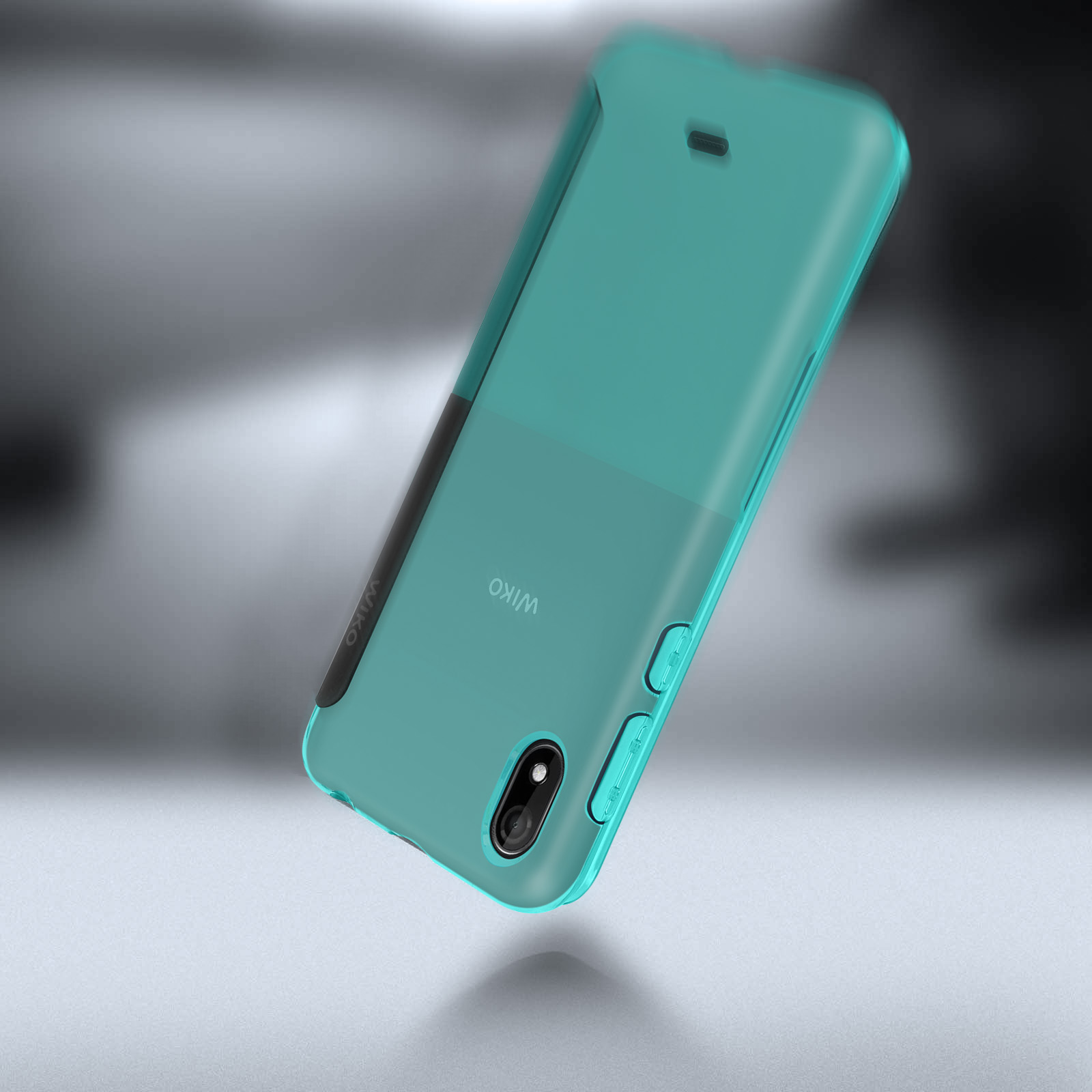 Custodia turchese per telefono, leggermente inclinata, su sfondo grigio sfocato. Marchio Wiko visibile.
