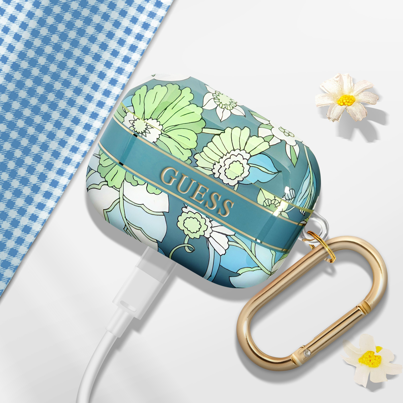 Funda AirPods floral con cierre dorado, cable y margaritas.