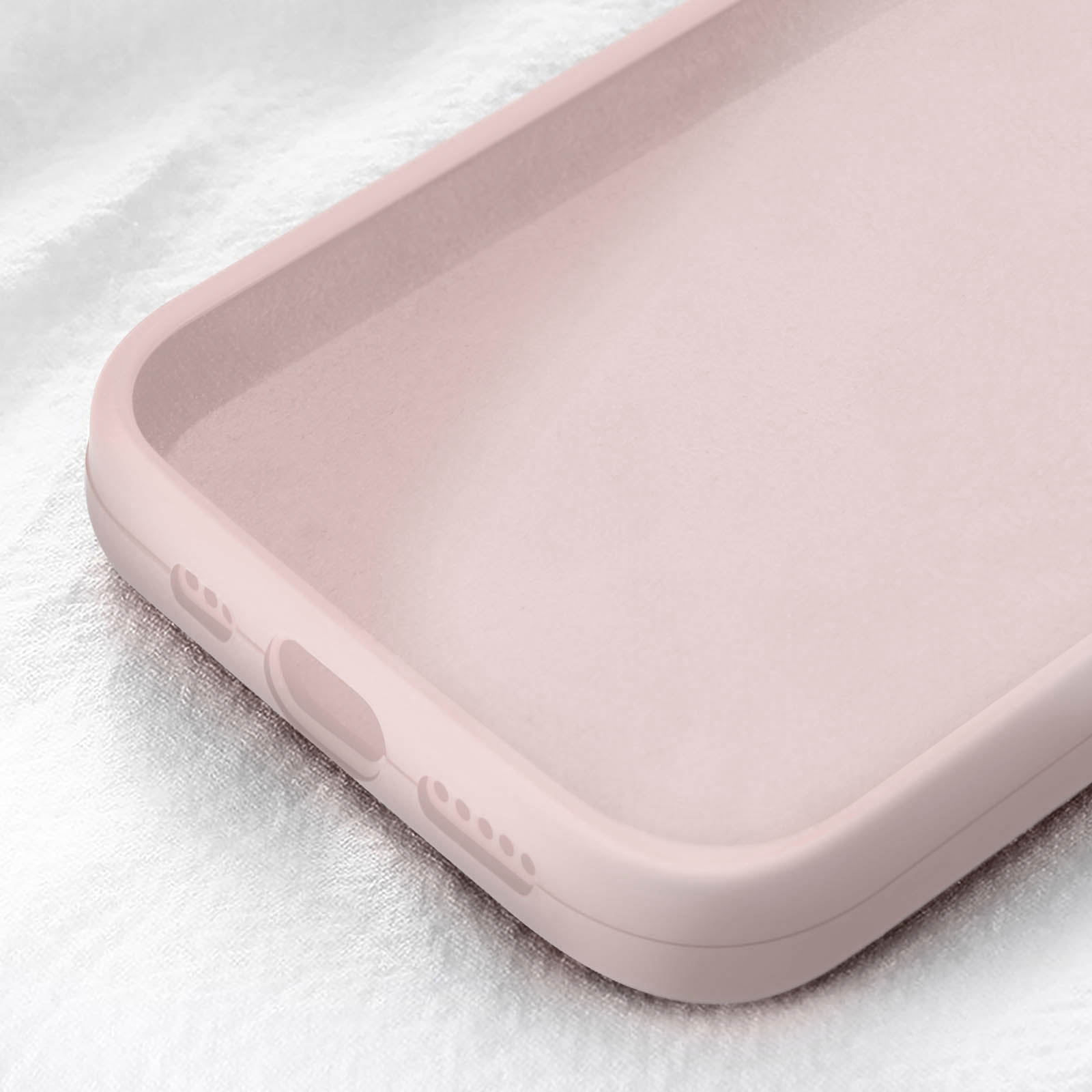 Primo piano dell'interno di una custodia per telefono rosa chiaro.