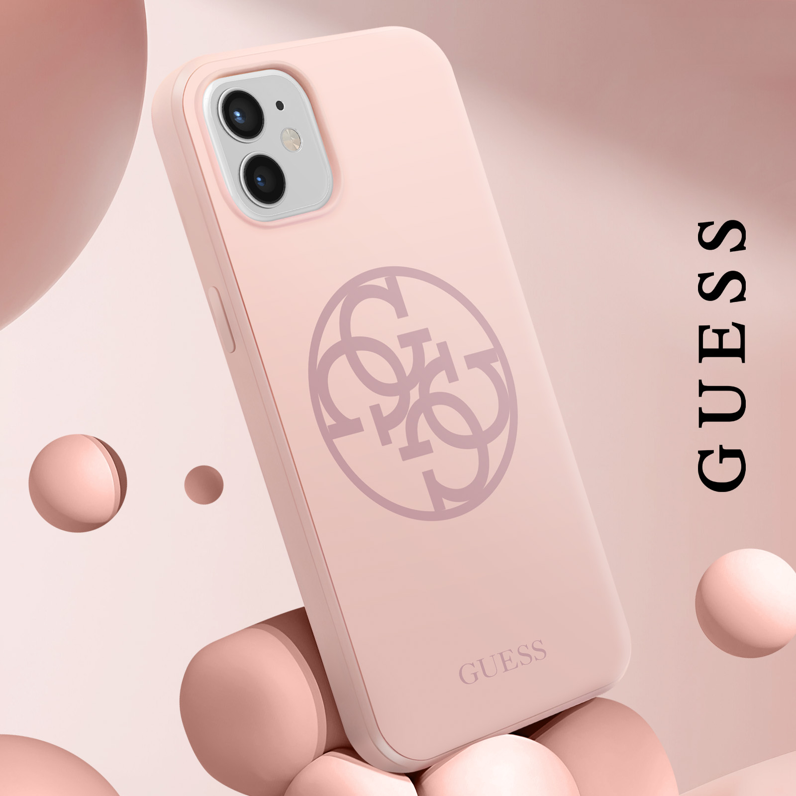 Roze GUESS telefoonhoesje. Logo en merknaam. Roze achtergrond. Bollen zijn zichtbaar.