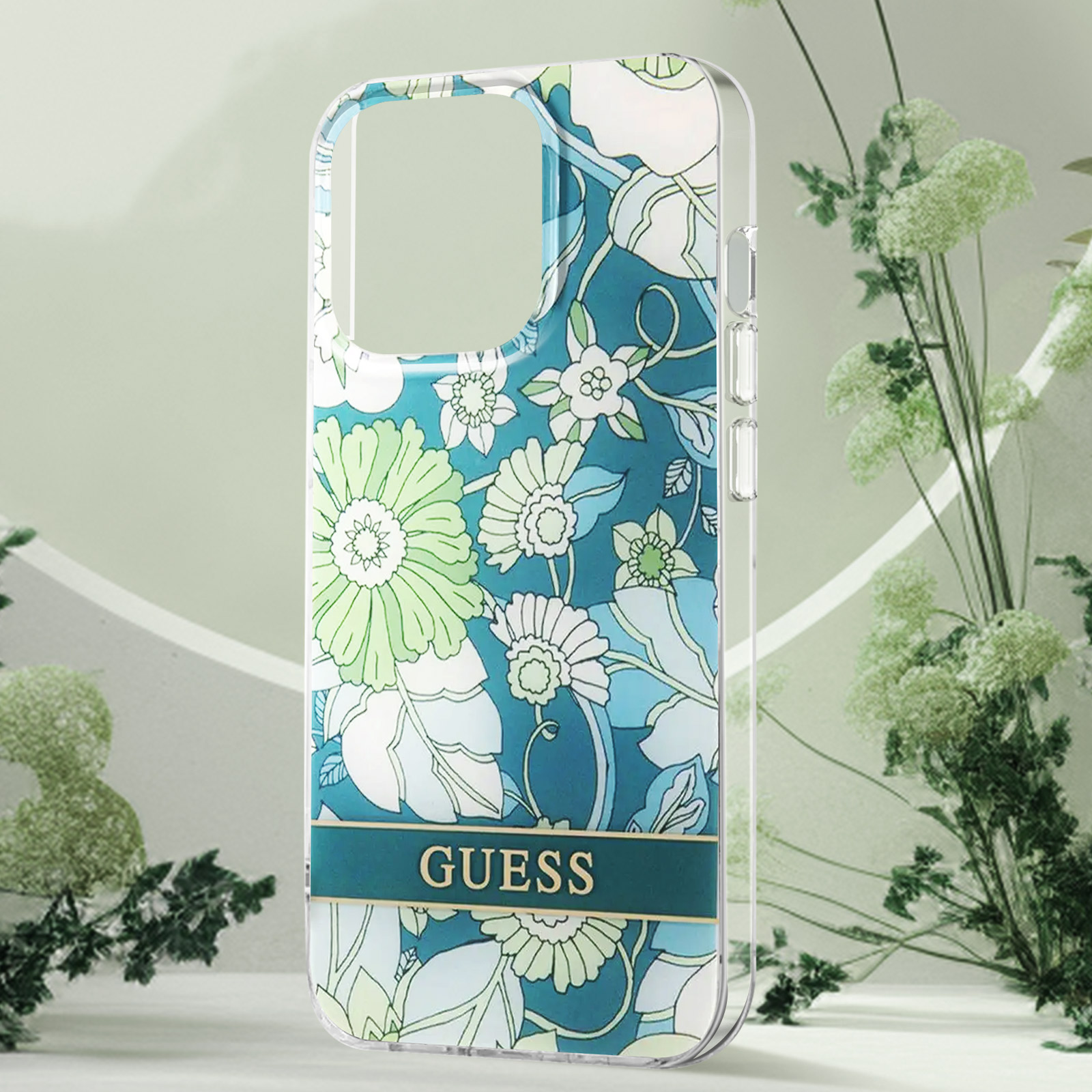 Telefono in una custodia trasparente con motivo floreale e logo Guess in basso.