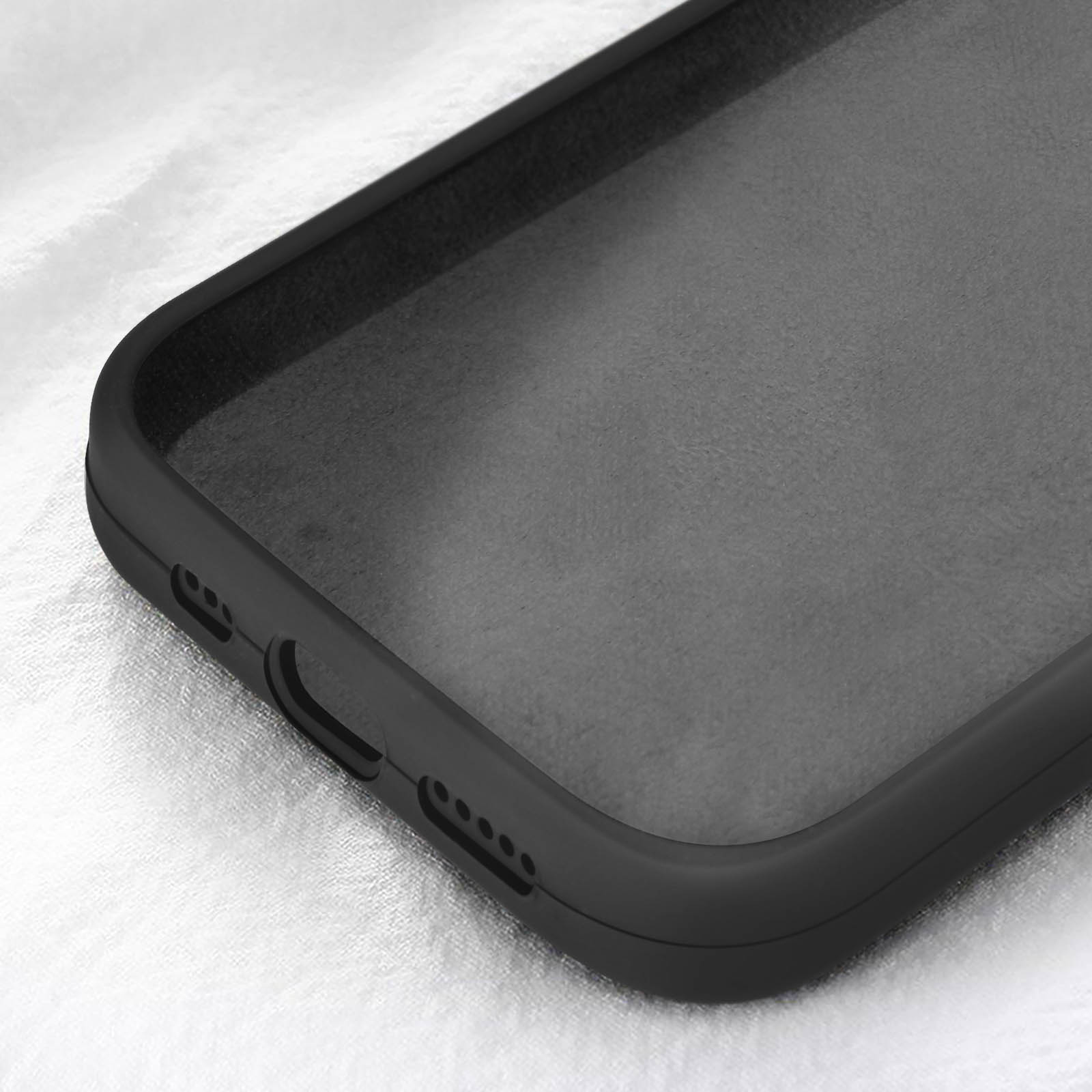 Primo piano dell'interno di una custodia nera per telefono. L'interno è grigio, la custodia è nera e ha delle aperture.