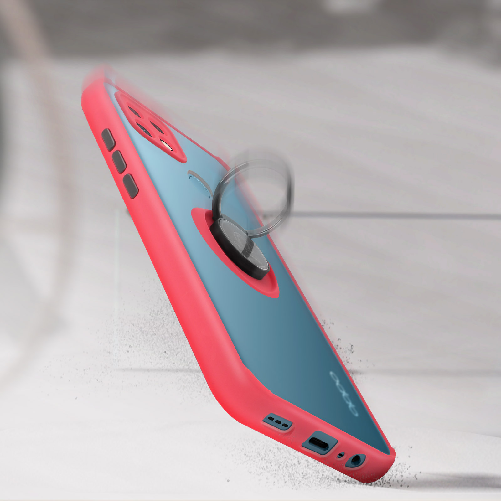 Una custodia per telefono con supporto ad anello, rosa e blu. La custodia sta cadendo, con macchie bianche intorno. L'anello è d'argento.
