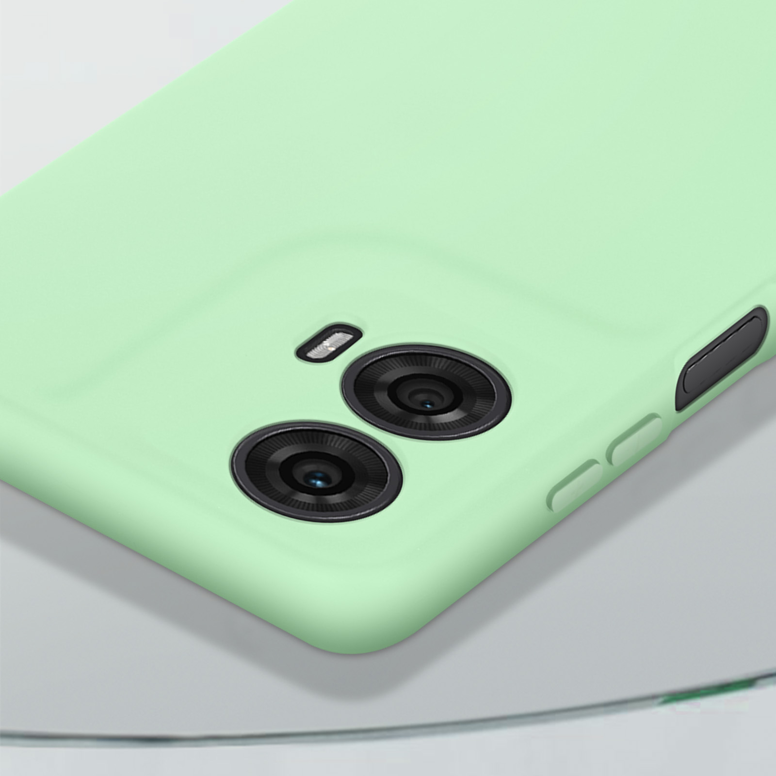 Handyhülle mit zwei Kameralinsen. Die Hülle ist mintgrün. Das Telefon liegt auf einer reflektierenden Oberfläche.