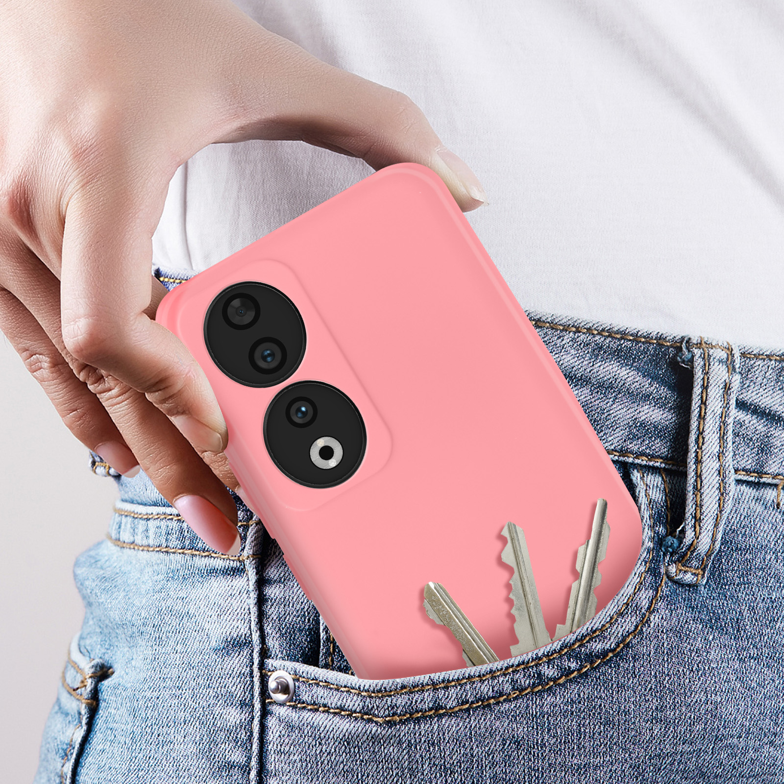 Custodia rosa per telefono in tasca dei jeans con chiavi visibili, che mostra il contesto.