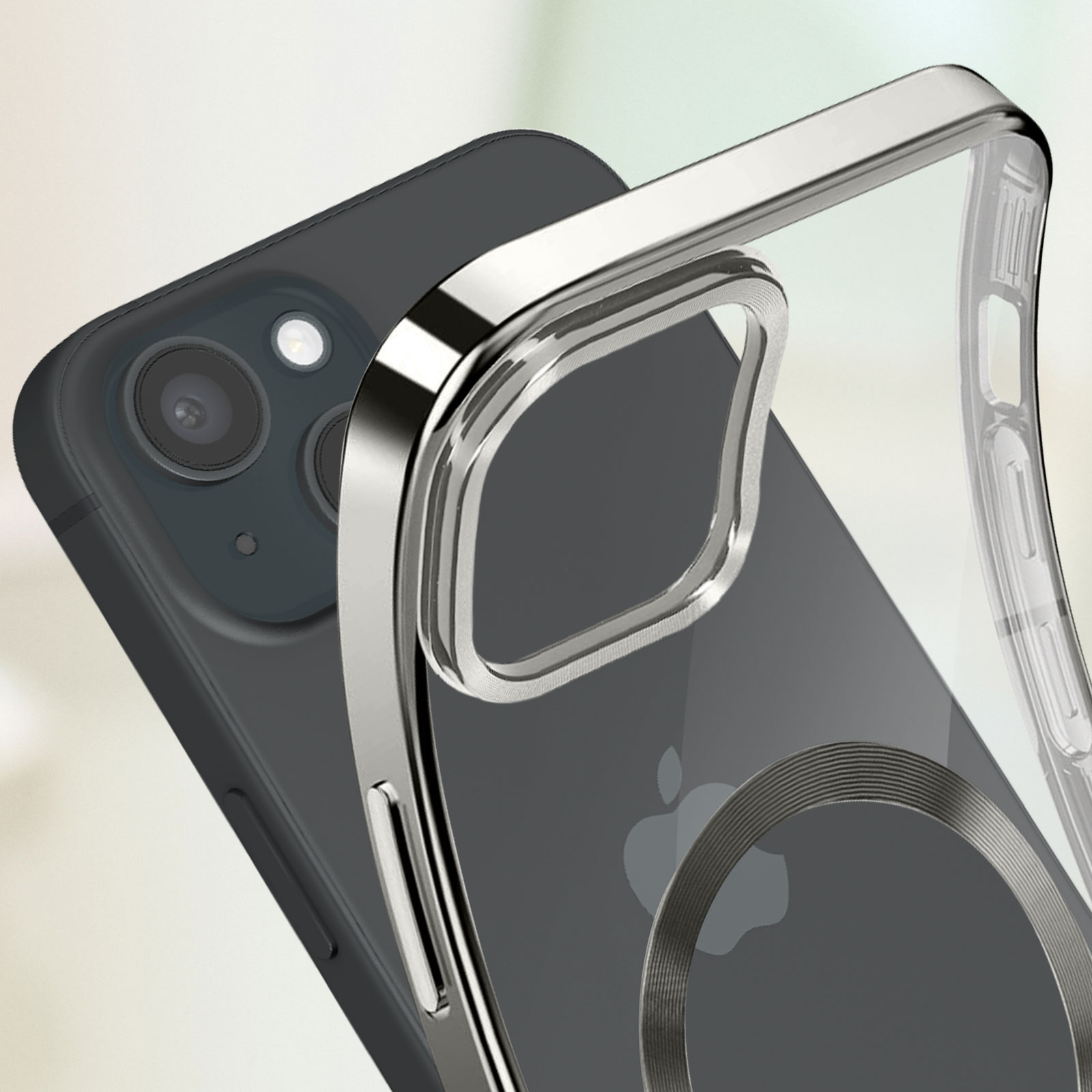 Custodia per telefono con anello in metallo argentato. Telefono con fotocamere visibili. Logo Apple.