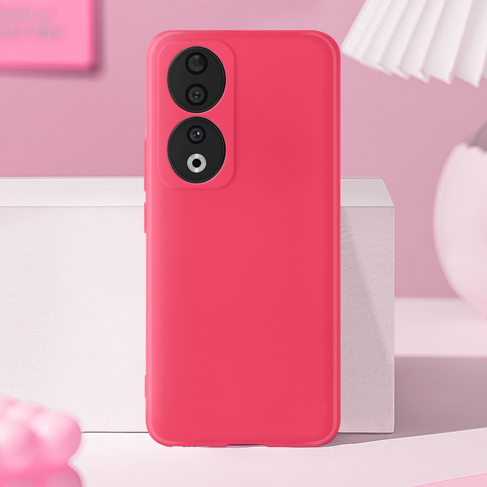 Custodia rosa per telefono con due obiettivi. Sfondo rosa.