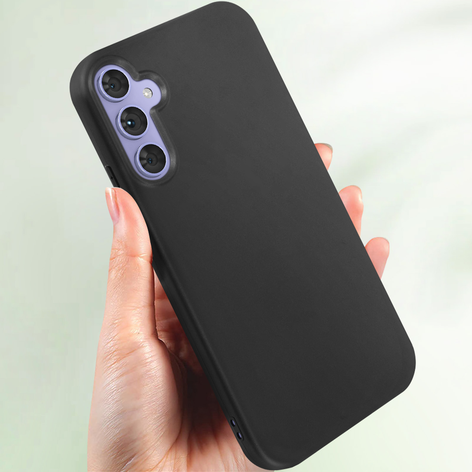 Mano che tiene un telefono nero, con fotocamera e bordi arrotondati.