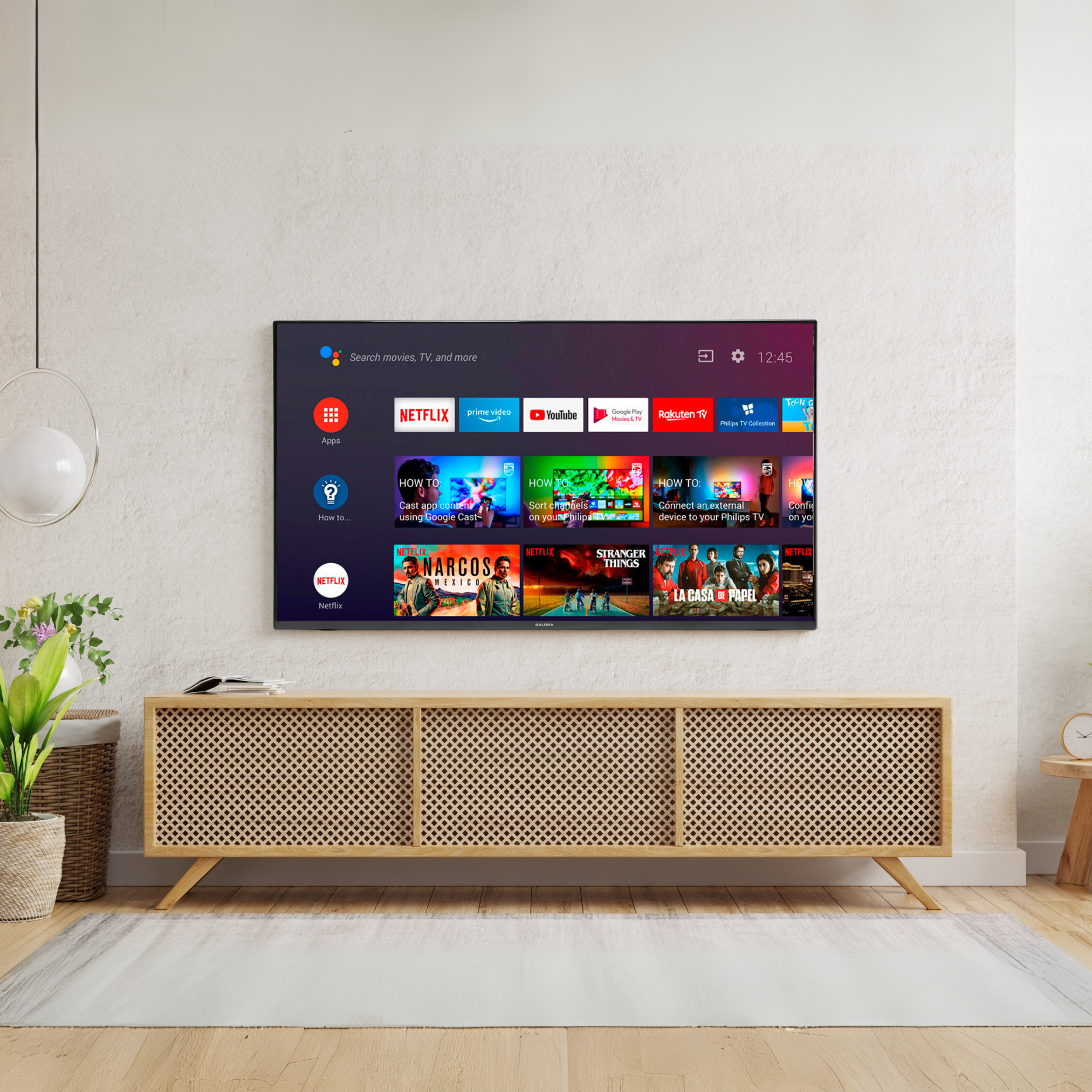 Un salon moderne avec une télévision sur une armoire en bois, affichant des icônes d'applications.