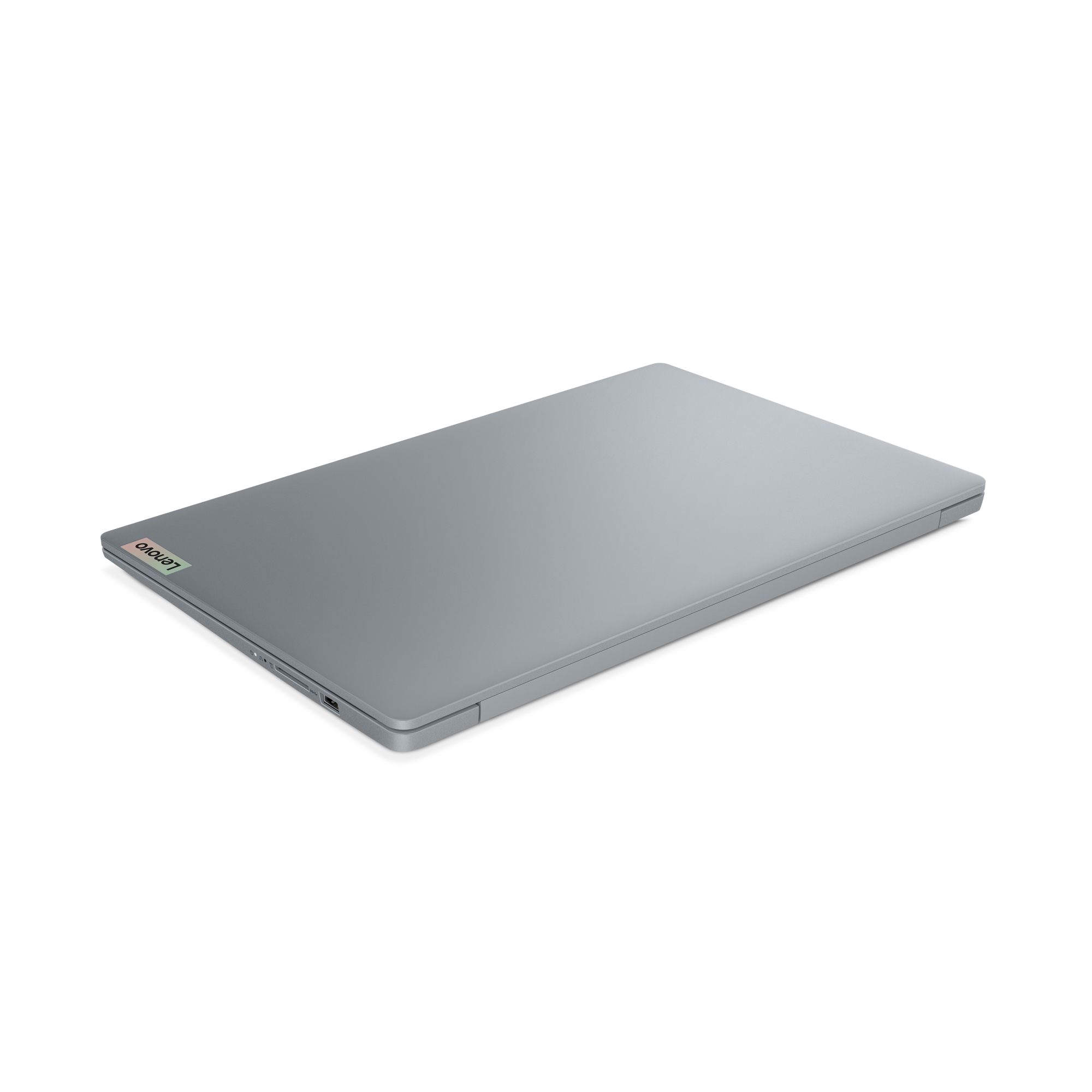 Un laptop argentato chiuso con il logo Lenovo.