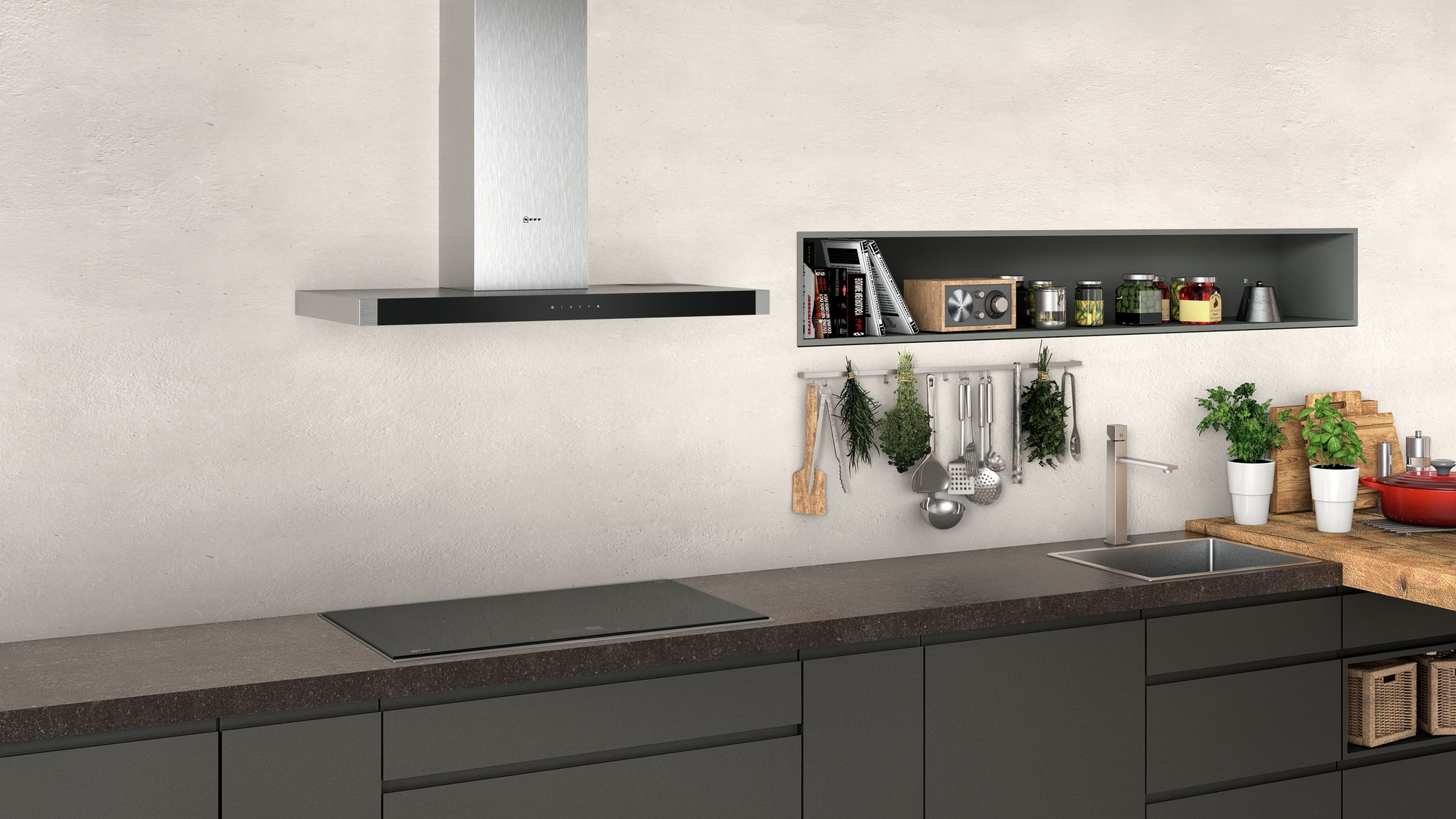 Modern kitchen with a stainless steel range hood, dark cabinets, and a minimalist shelf with items.