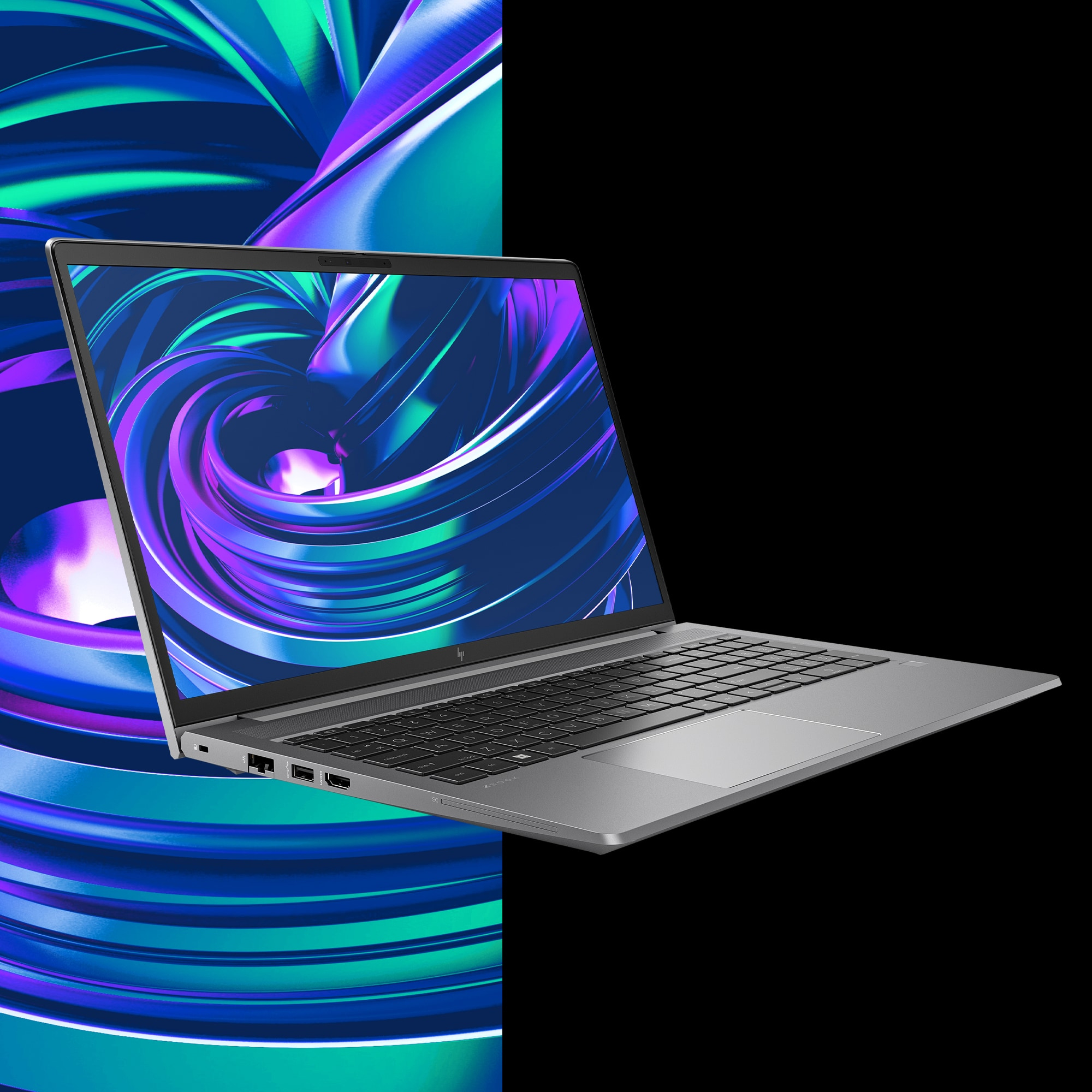 Laptop su sfondo nero, con un design a vortice colorato sul lato sinistro dello schermo.