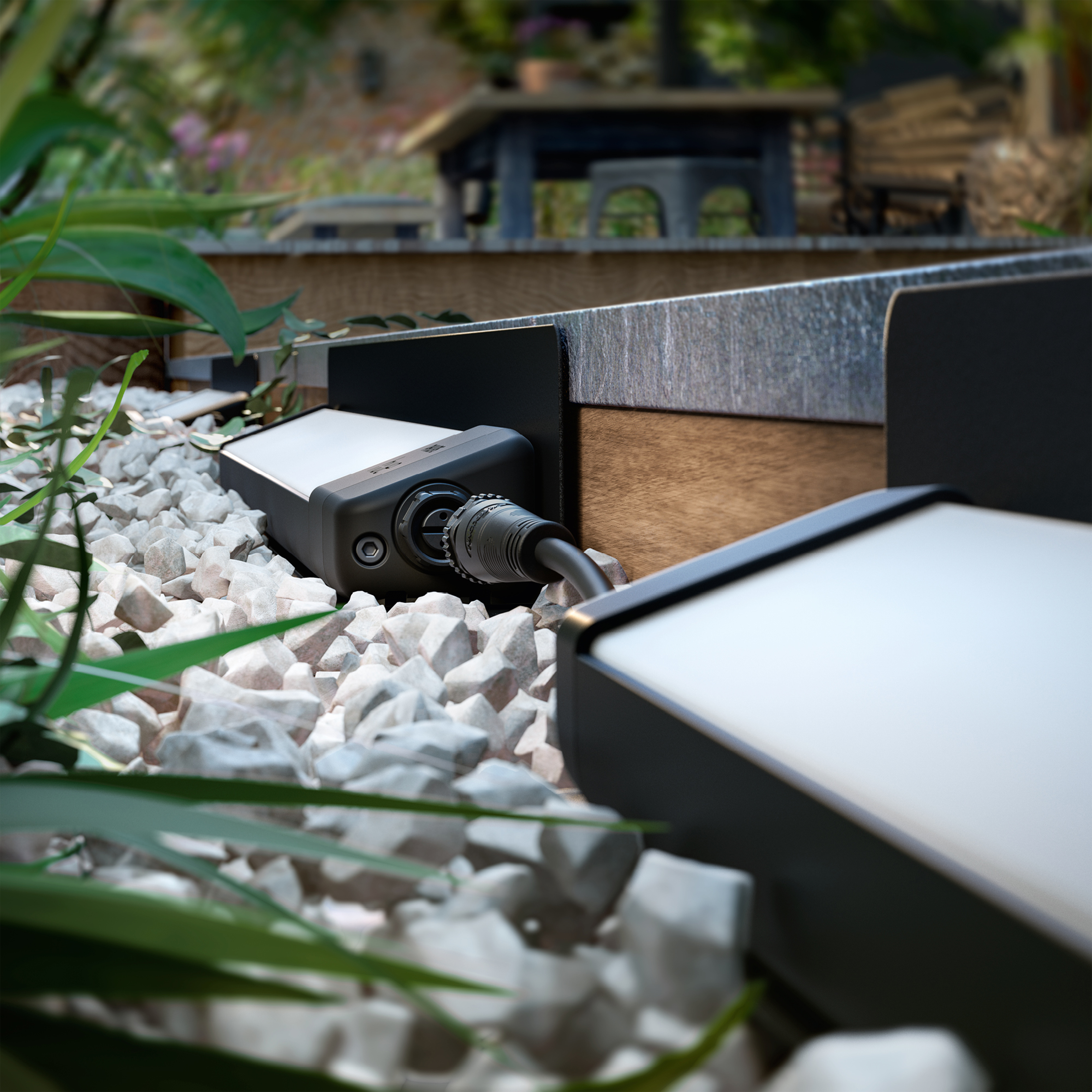 Zewnętrzny system oświetleniowy. Dwie czarne lampy z białym światłem. Widoczne kamyki i rośliny.