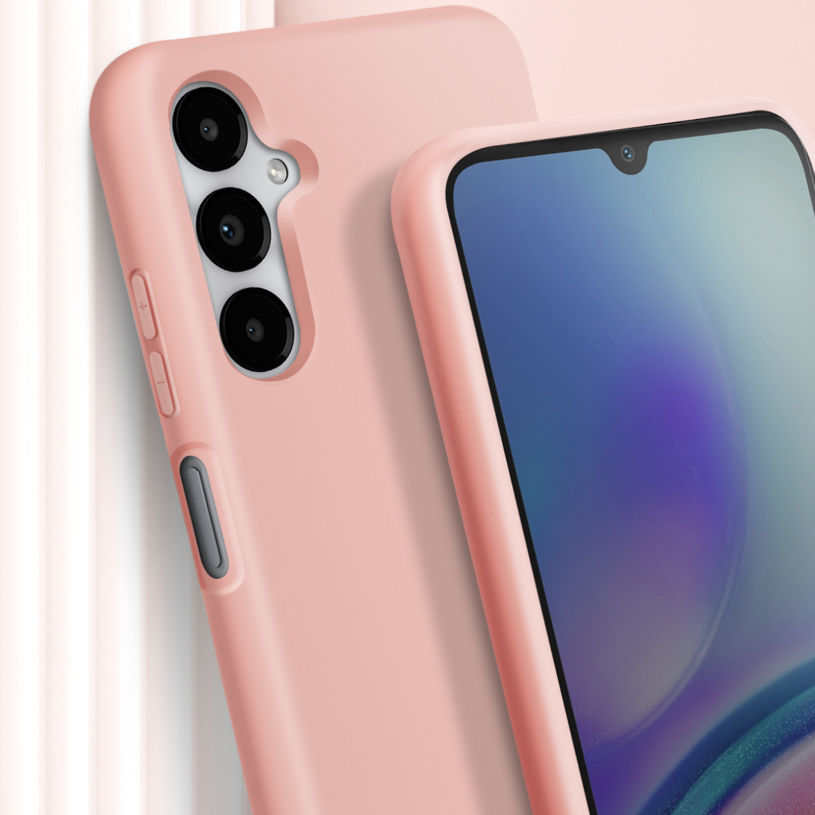 Gros plan sur deux coques de téléphone roses, avec un écran de téléphone visible à droite.