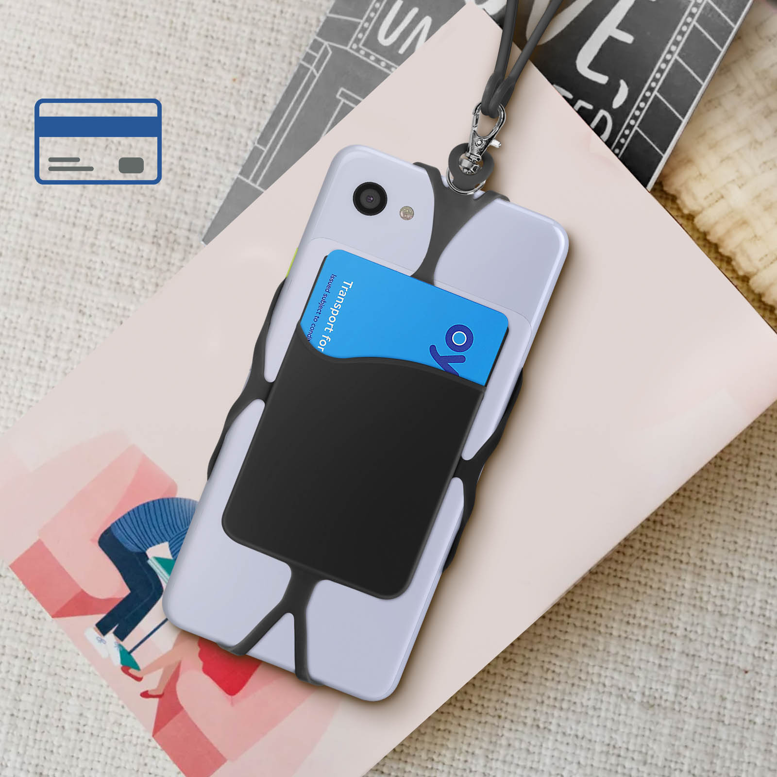 Telefono in una custodia con porta carte. Una carta è nel supporto. Il telefono è su un libro.