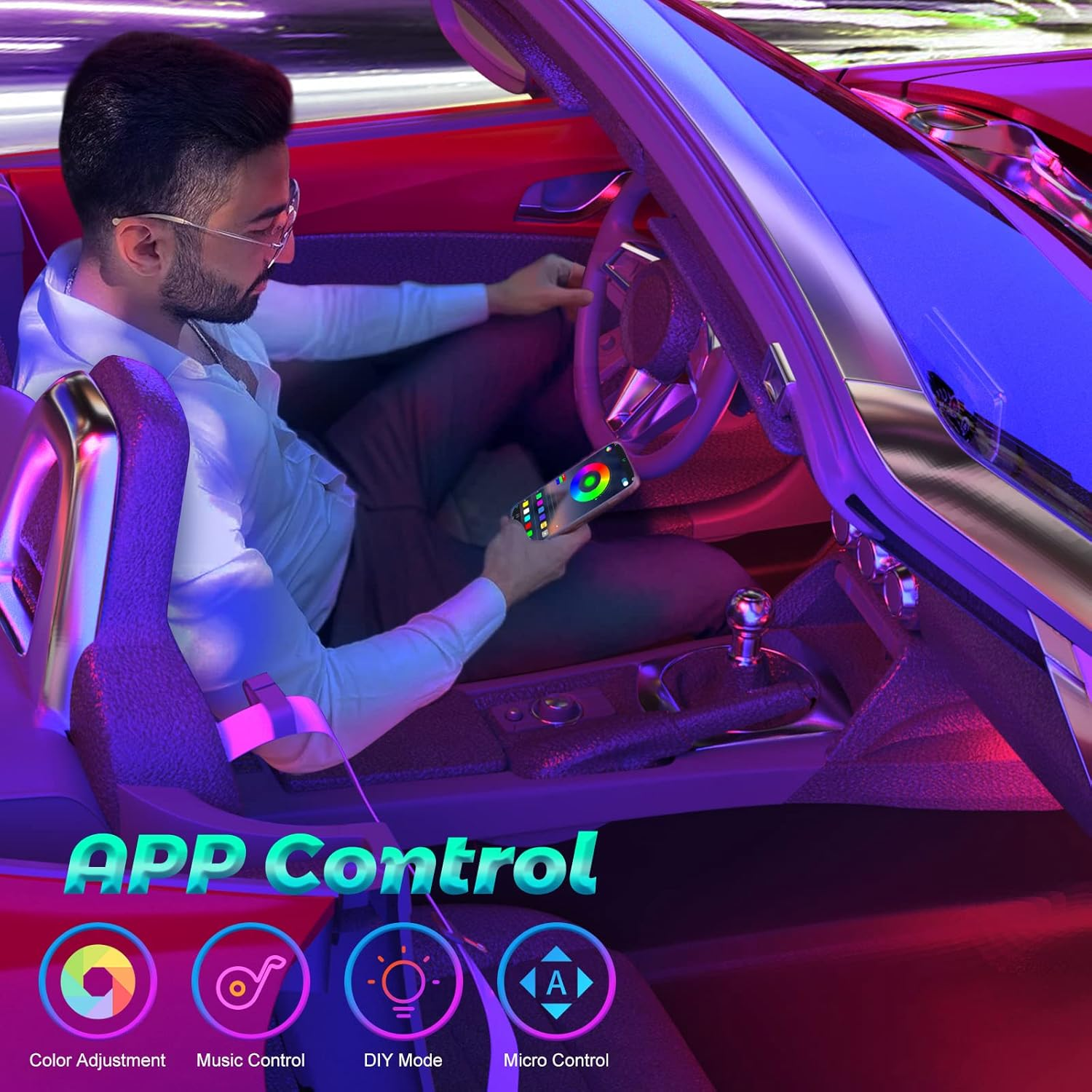 Ein Mann in einem Auto benutzt ein Telefon mit einer App für Farbe, Musik, DIY und Mikrokontrolle.