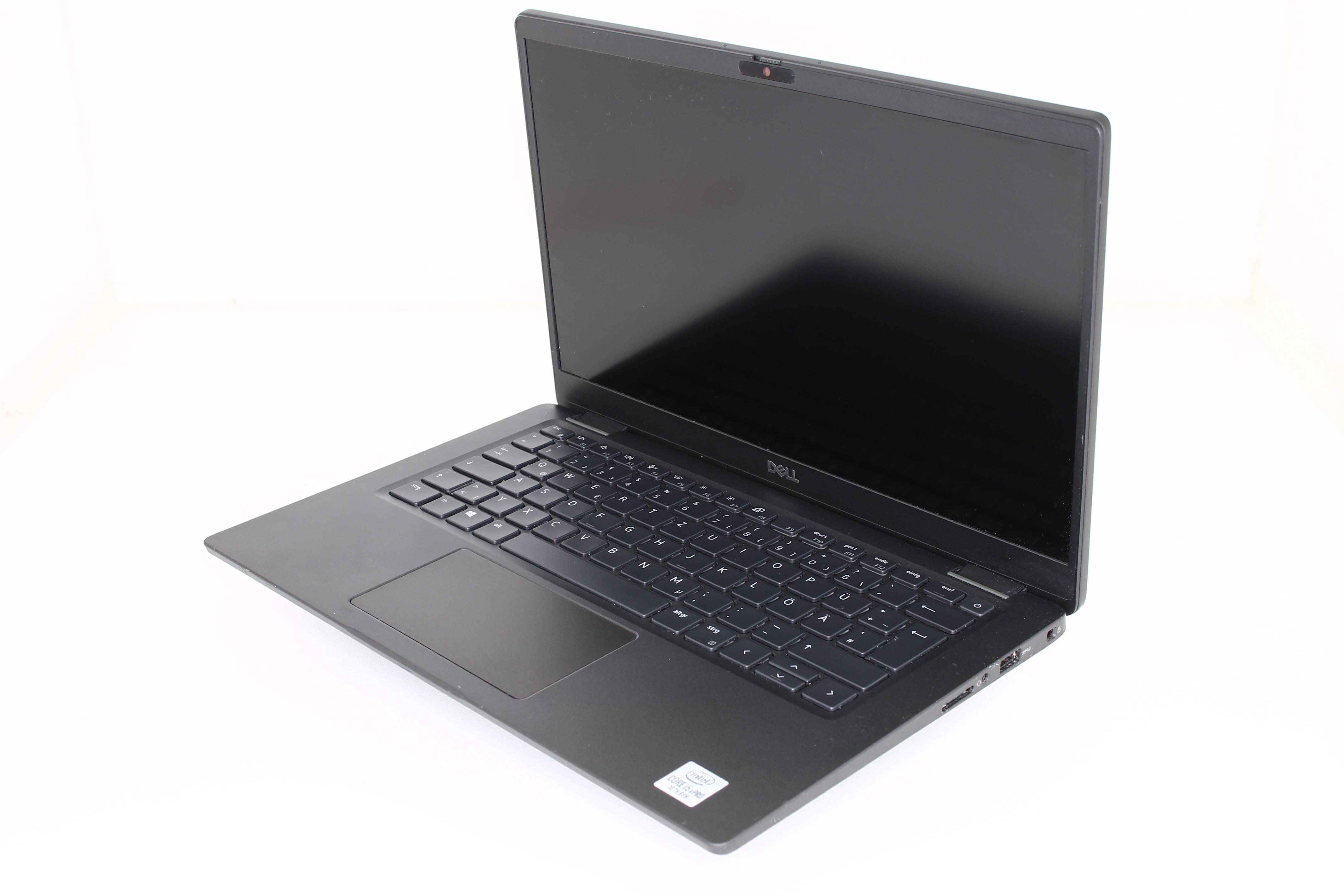 Ein schwarzer Laptop, geöffnet, auf einer weißen Oberfläche platziert. Tastatur sichtbar. Der Bildschirm zeigt ein schwarzes Bild.
