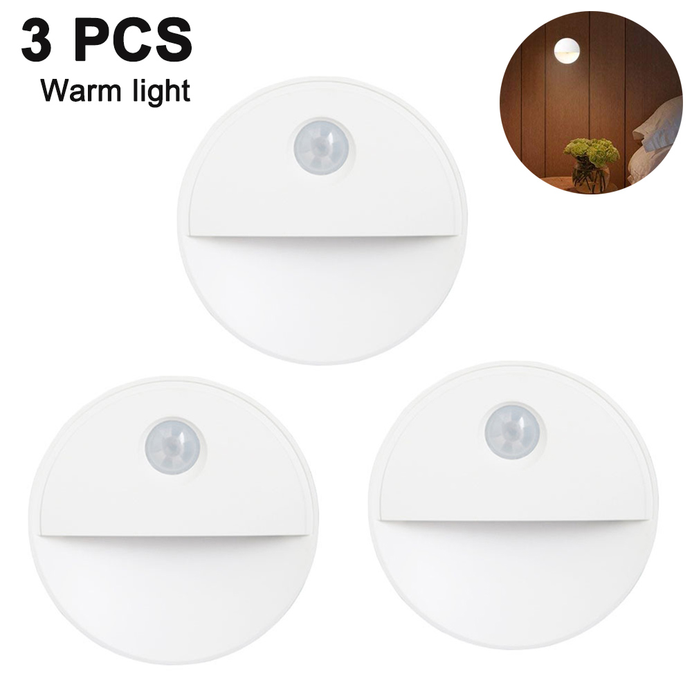 Drei weiße, runde LED-Leuchten mit Bewegungssensoren. Warmes Licht wird gezeigt.