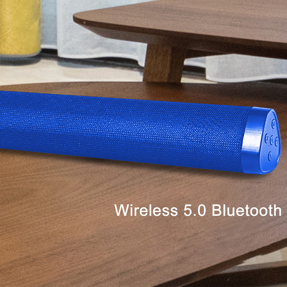 Ein blauer Lautsprecher mit Text 'Wireless 5.0 Bluetooth' auf einem Holztisch.