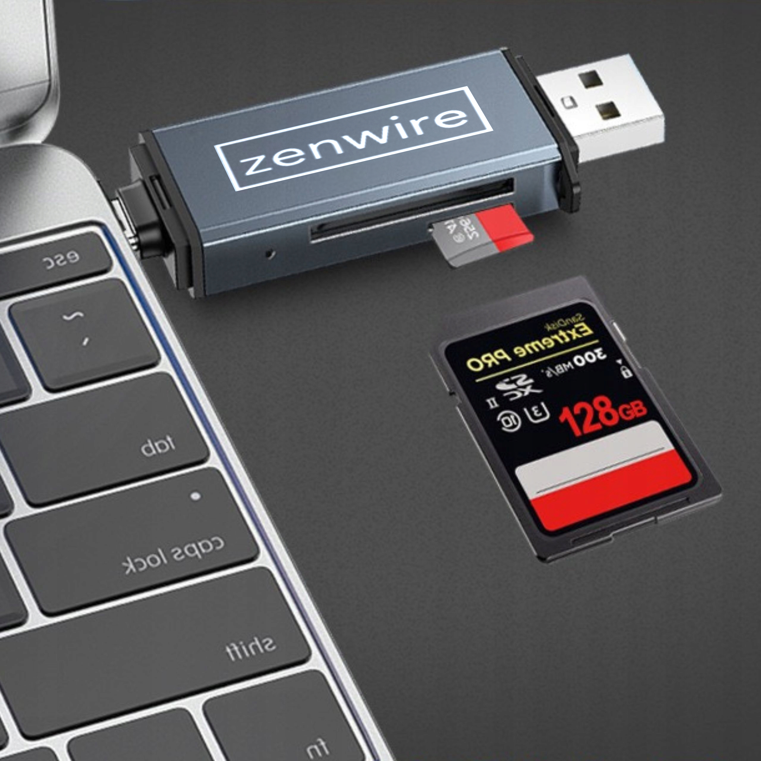 Srebrny czytnik kart z włożoną czerwoną kartą SD, klawiatura laptopa w tle.