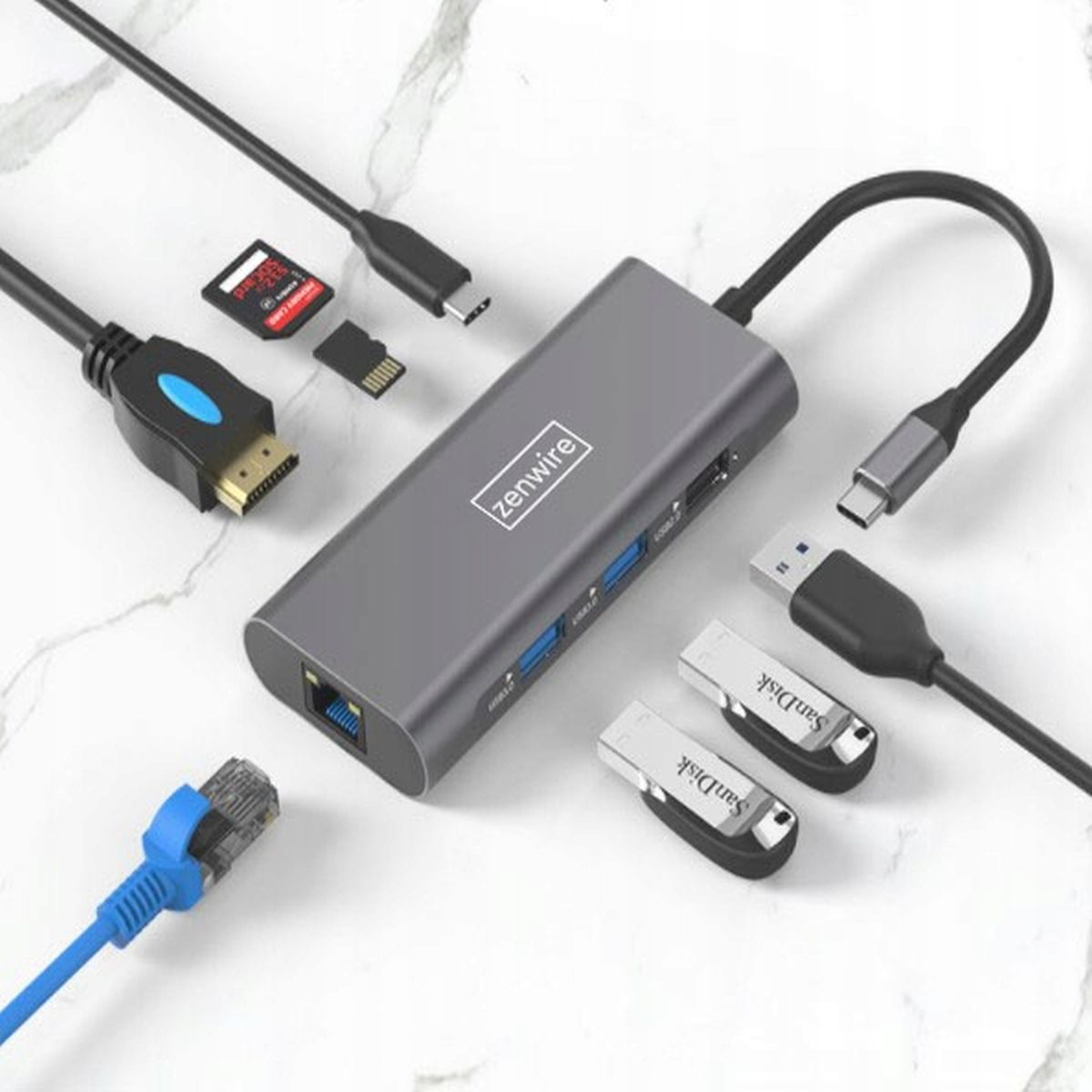 Szary hub USB z wieloma złączami, z pendrive'ami Sandisk i kablami.