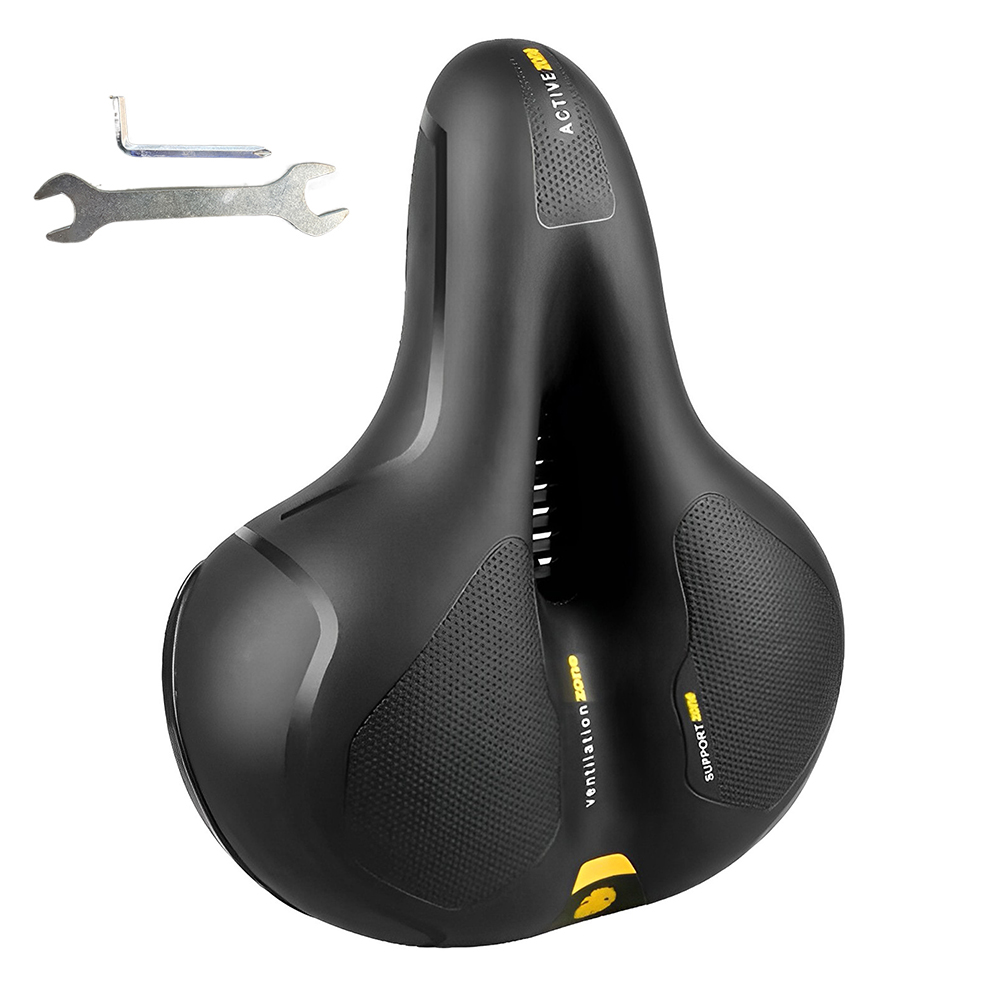 Schwarzer Fahrradsattel mit Belüftungszone und Markierungen, neben einem Schraubenschlüssel.