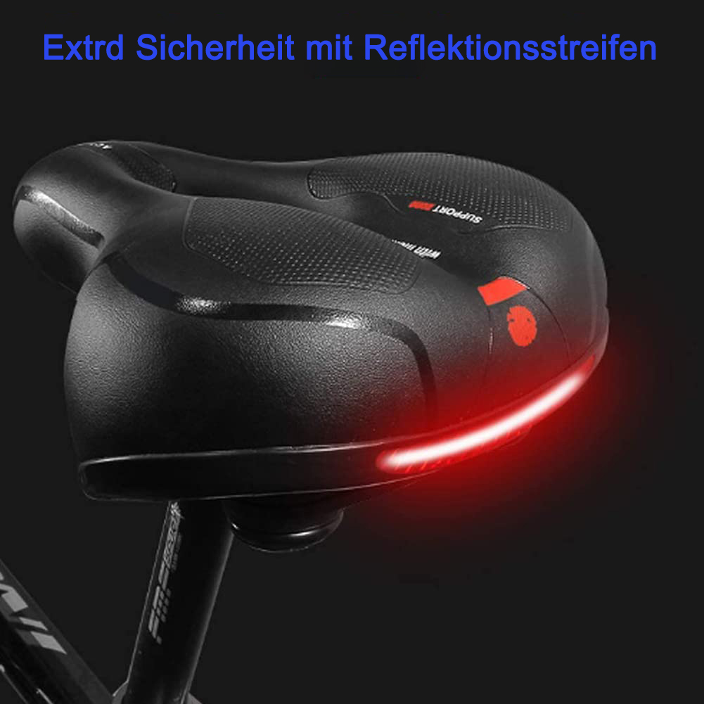 Schwarzer Fahrradsattel mit reflektierendem roten Licht auf der Rückseite, mit schwarzem Hintergrund.