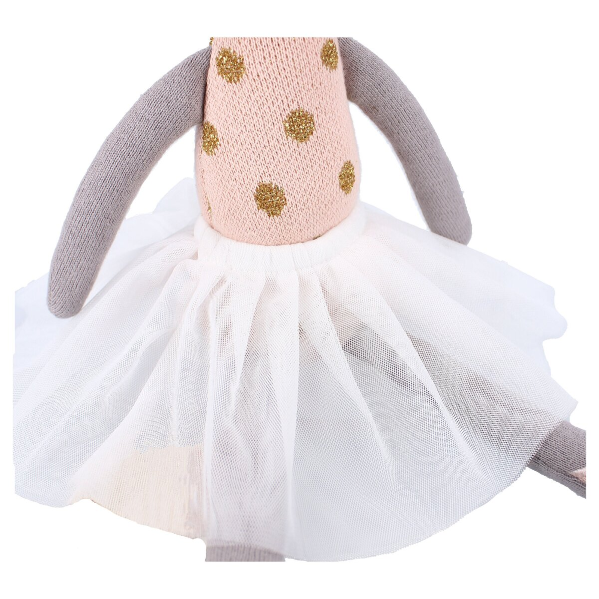 Eine Puppe mit einem rosa Oberteil mit goldenen Punkten, einem weißen Tutu und grauen Armen und Beinen.