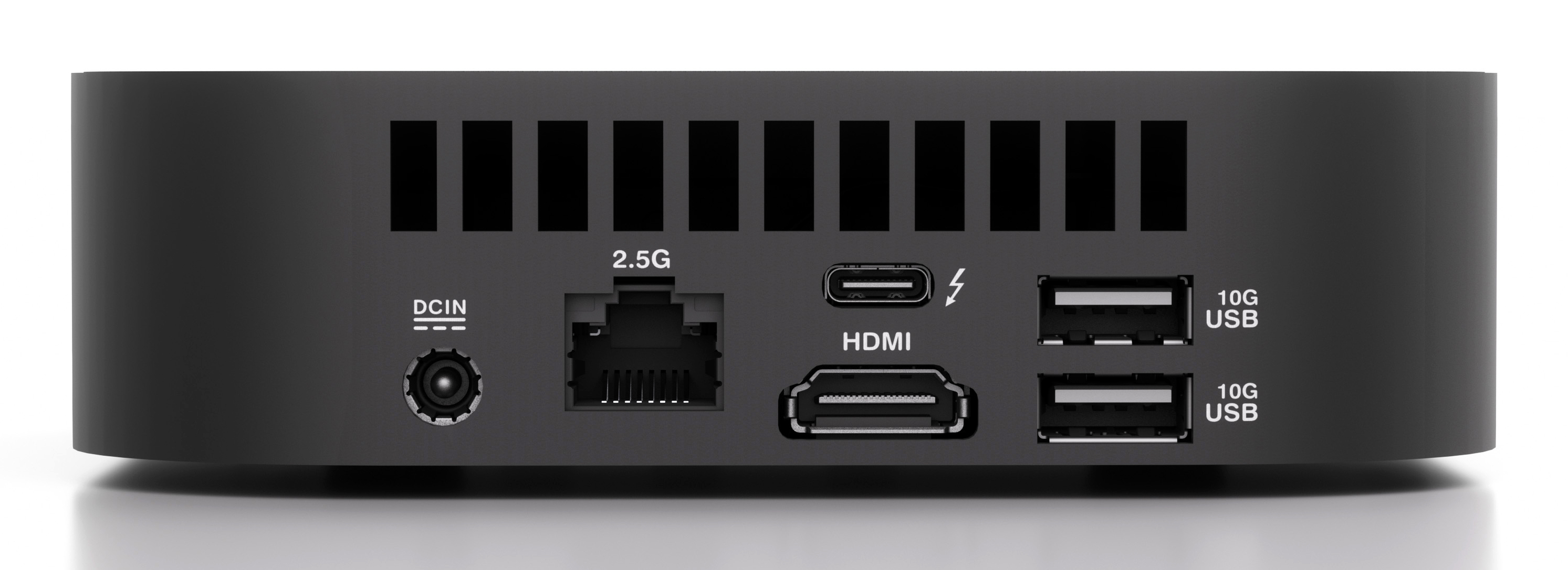 Tył czarnego komputera z wieloma portami, w tym USB, HDMI i Ethernet.