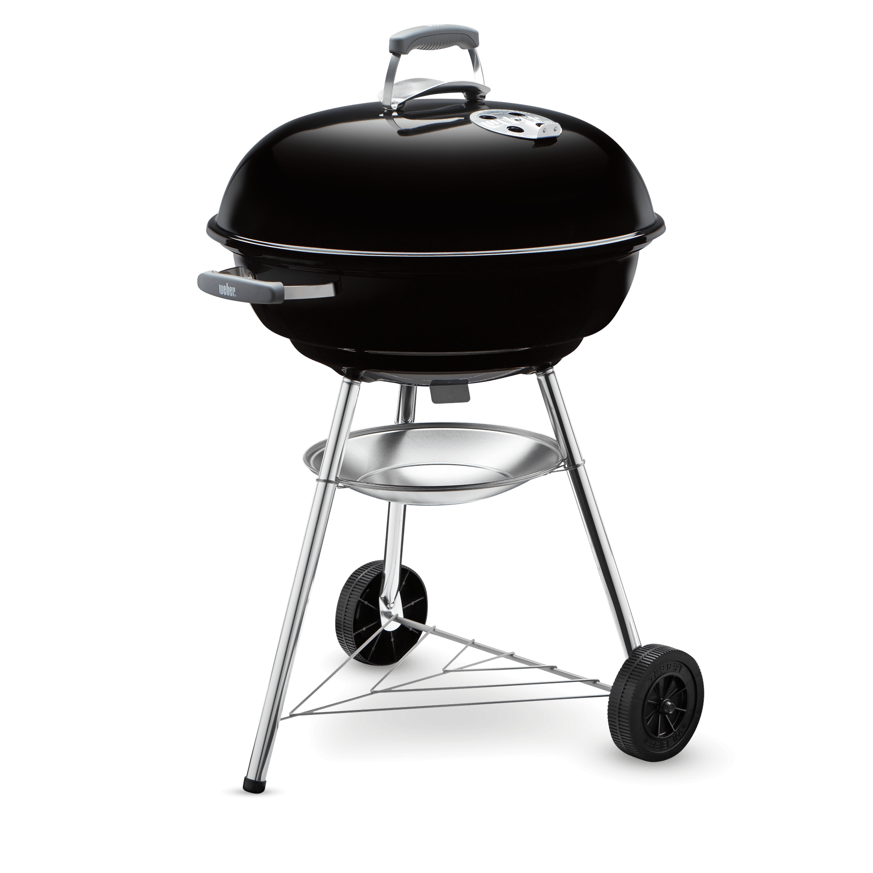 Griglia Weber nera su una superficie nera. Ha una griglia argentata e ruote.