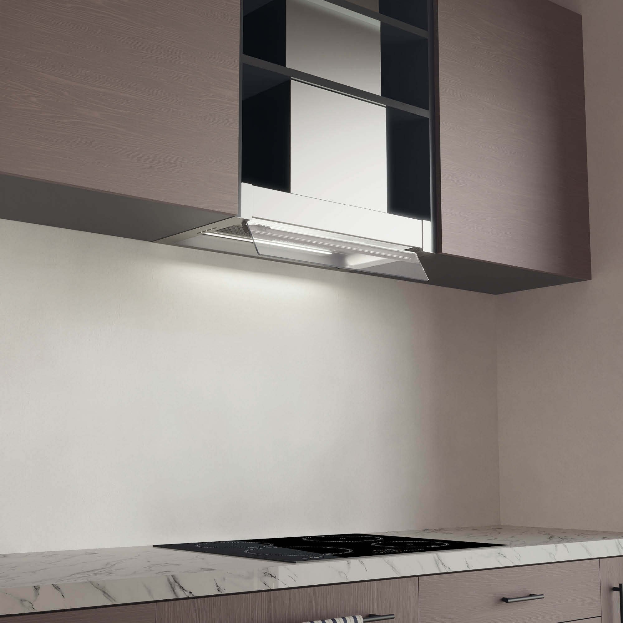 Campana de cocina sobre una estufa negra con una luz que ilumina la superficie de cocción.