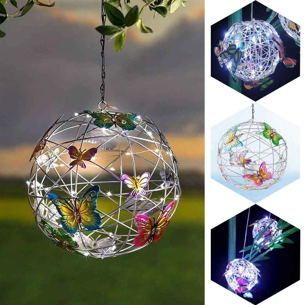 Hängende Metallkugel mit Schmetterlingen und Lichtern. Mehrere Ansichten zeigen Variationen. Garteneinstellung.