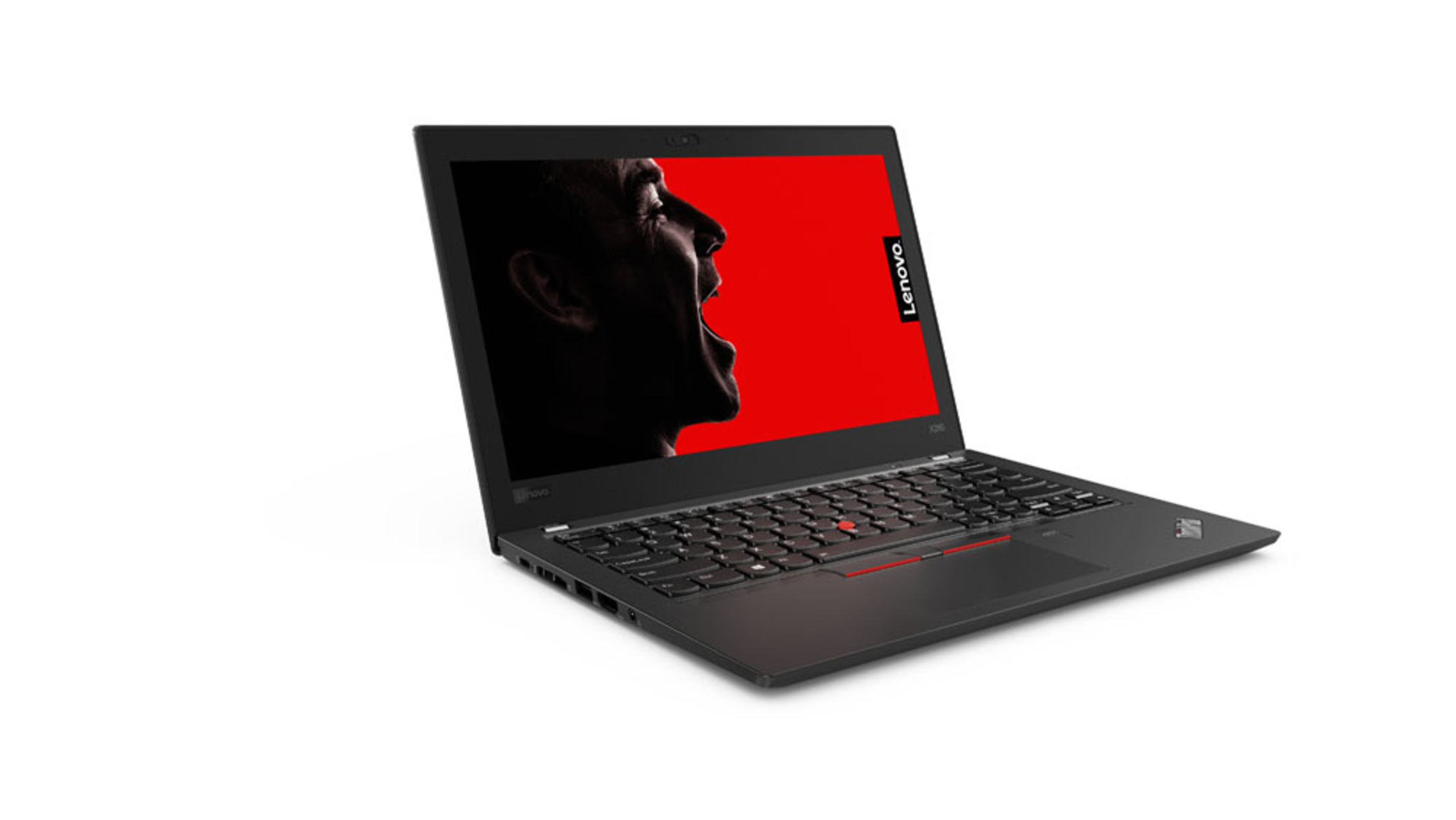 Schwarzer Lenovo-Laptop mit schreiendem Gesicht auf dem Bildschirm. Roter Hintergrund.