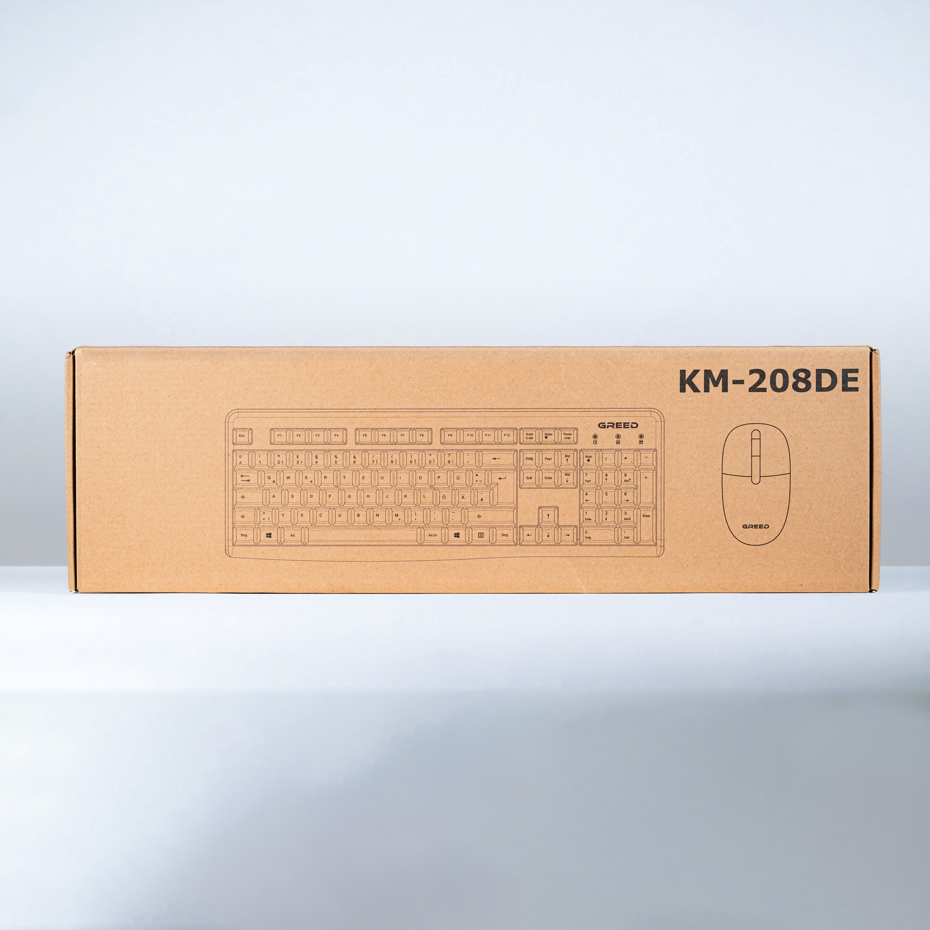 Eine braune Box für Tastatur und Maus. Das Tastaturlayout ist auf die Box gedruckt.
