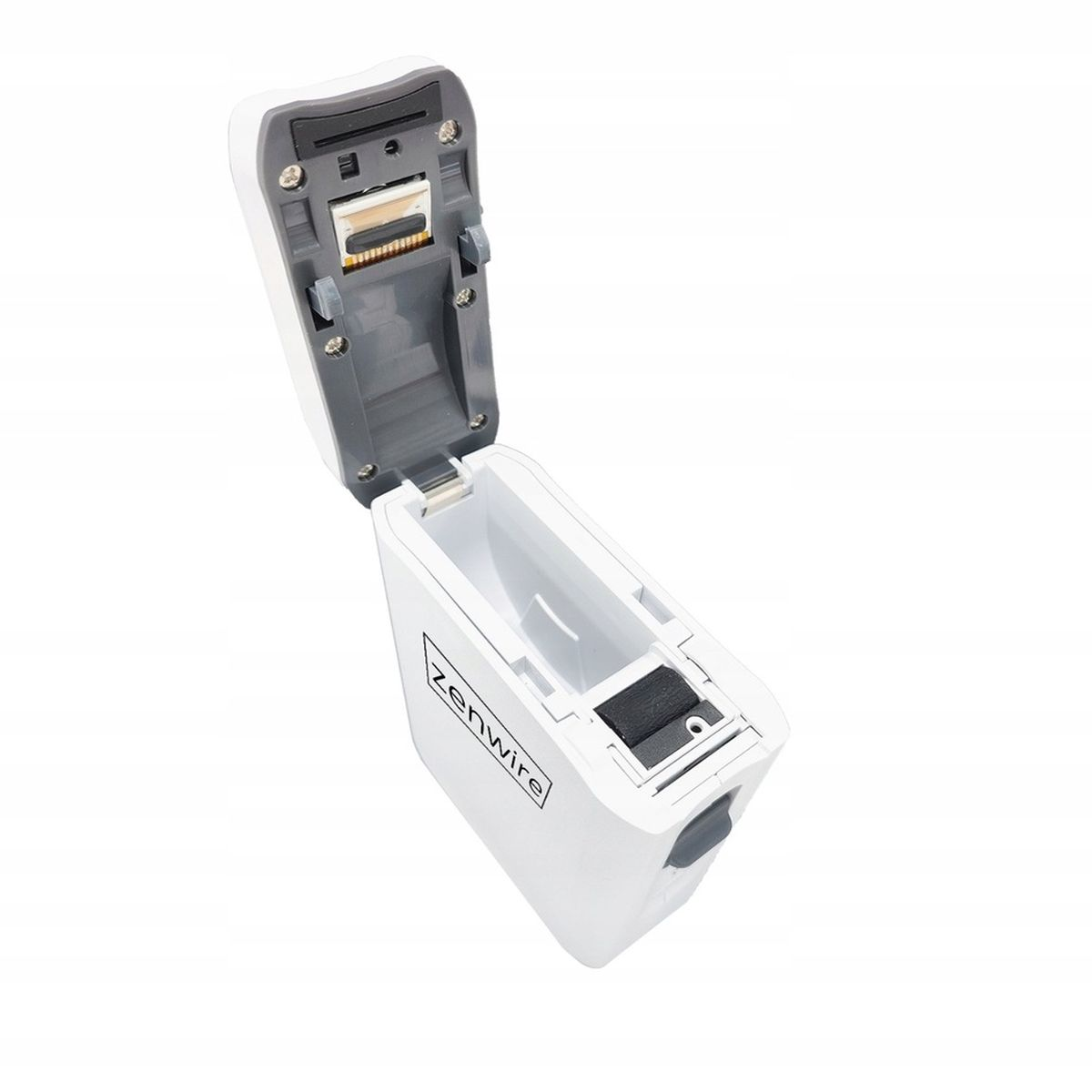 Białe prostokątne urządzenie, prawdopodobnie ładowarka, otwarte, aby odsłonić wnętrze. Ma etykietę 'zenwire'.