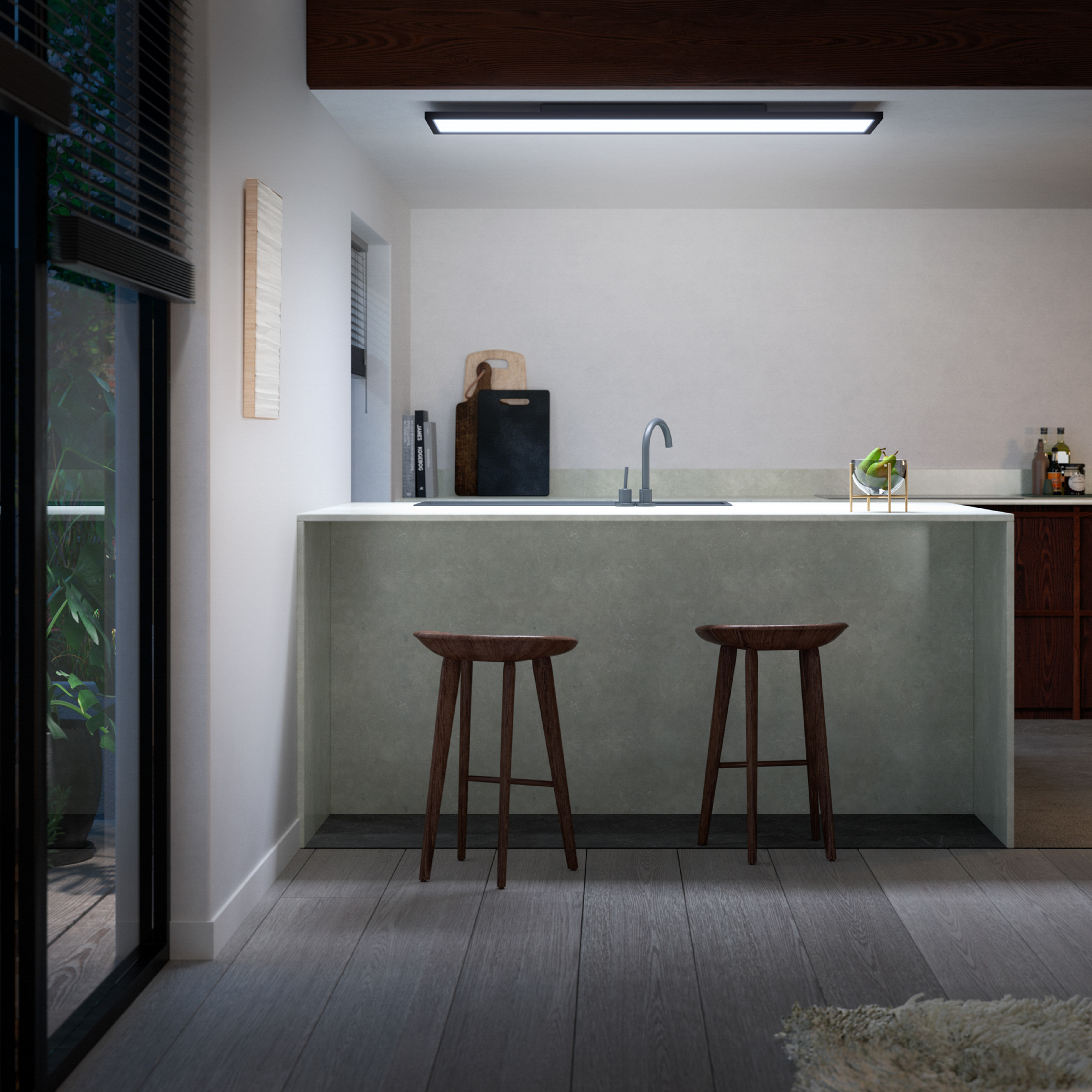 Interni cucina moderna con bancone, due sgabelli, illuminazione e finestra sull'esterno.