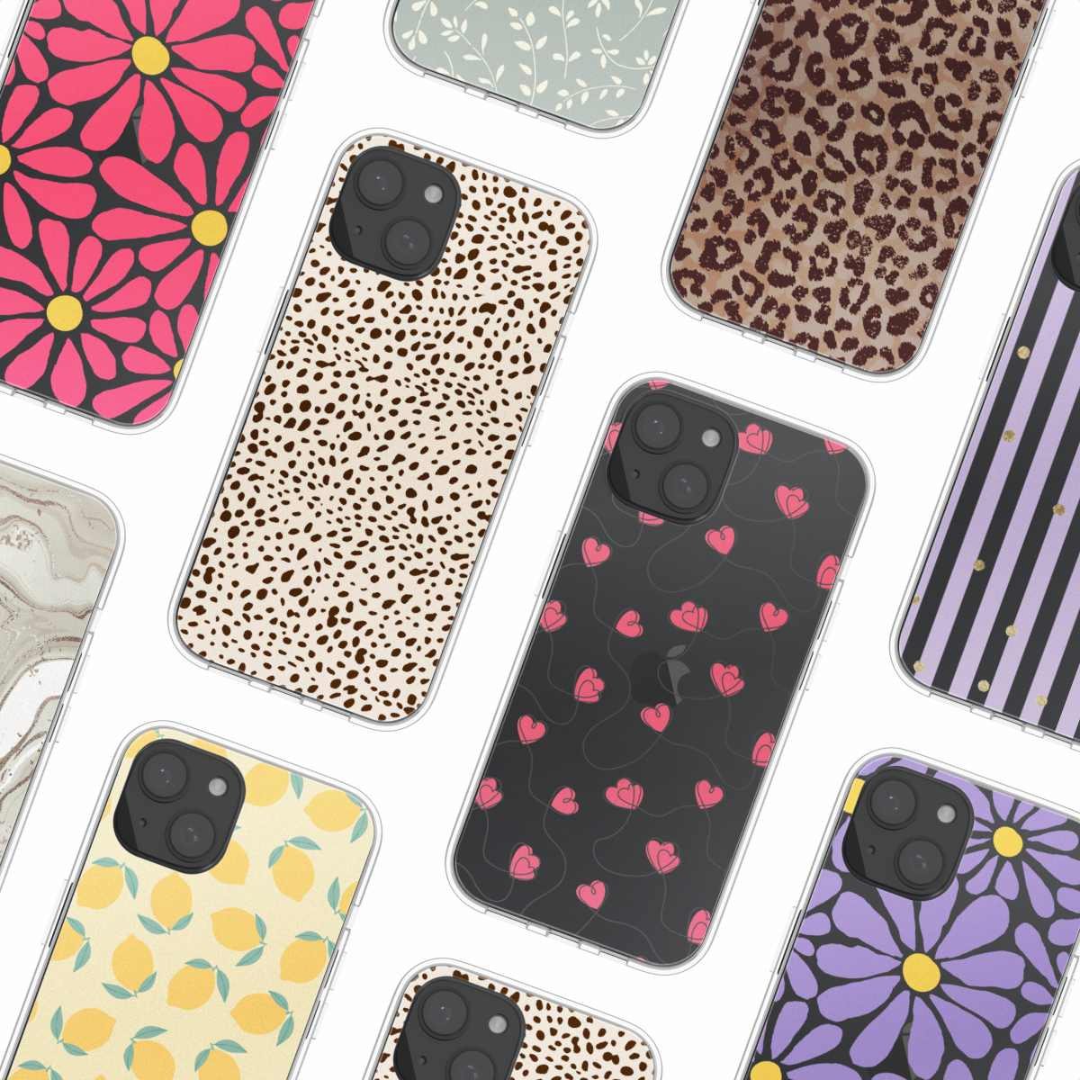 Diverse telefoonhoesjes met verschillende patronen zoals bloemen, luipaardprint en citroenen, op een wit oppervlak.