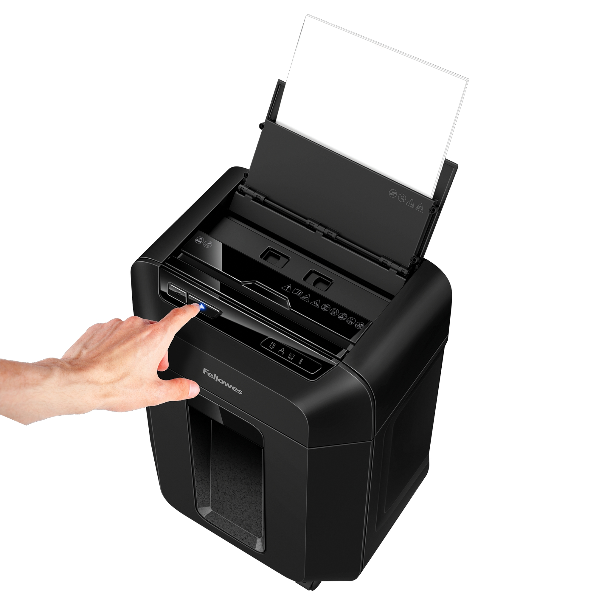 Black paper shredder with a hand pressing the power button. A sheet of paper is ready for shredding.