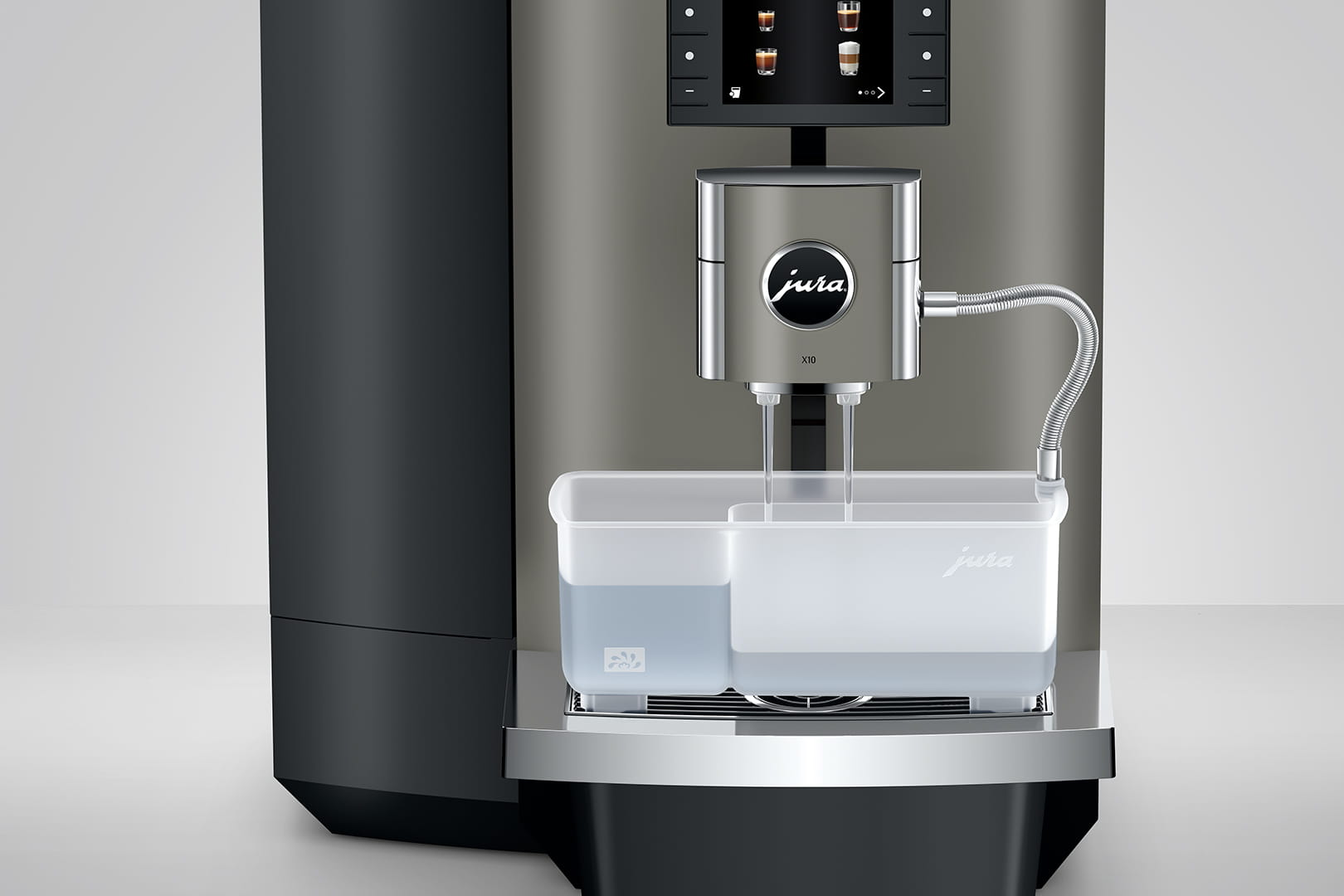 Espressomaschine mit Wassertank und zwei Ausgüssen über einem Tablett.