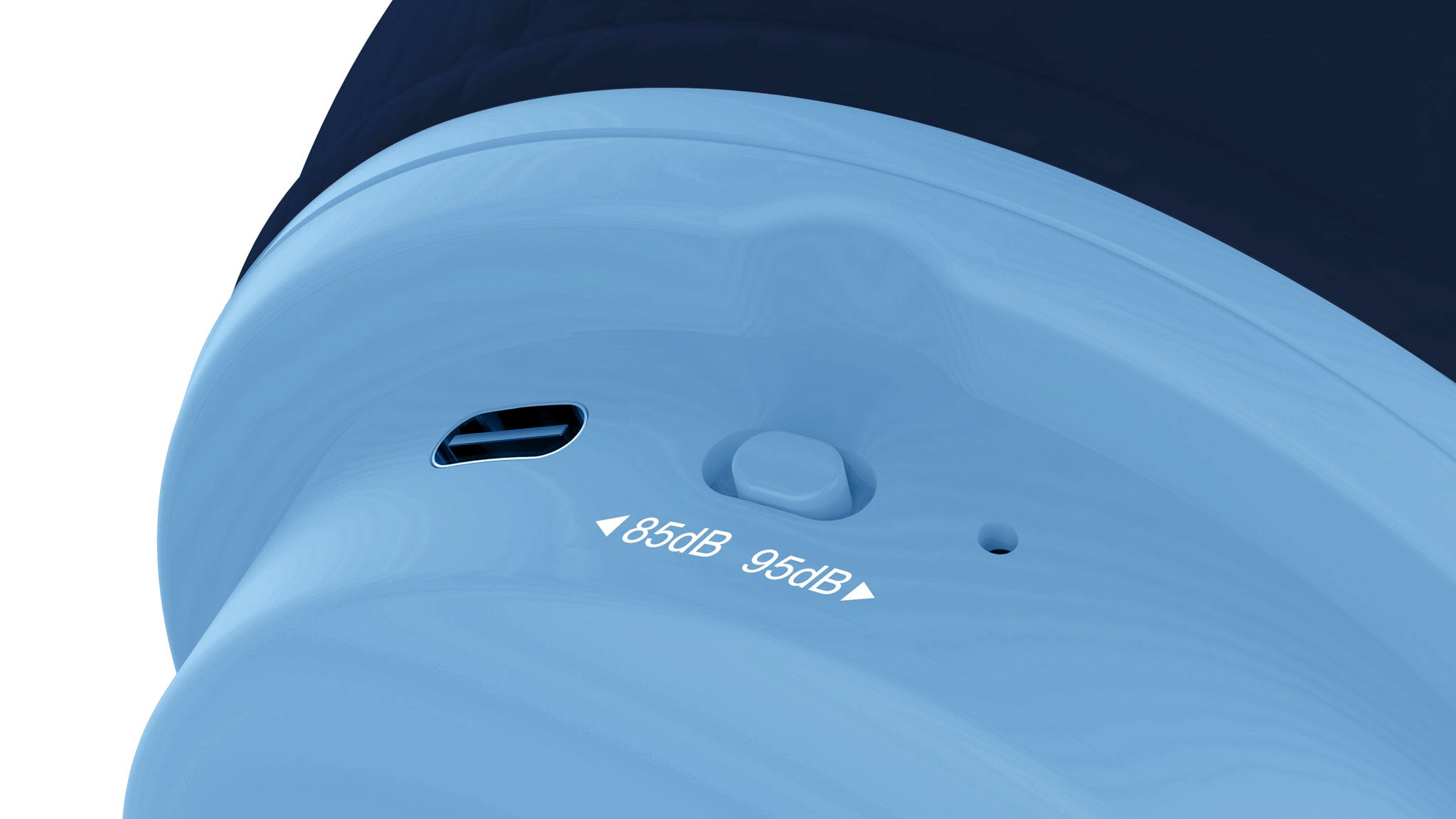 Zbliżenie górnej części niebieskiego urządzenia. Ma port ładowania, przycisk i wskaźniki głośności.