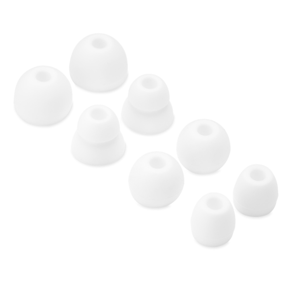 Kilka białych końcówek do słuchawek, w różnych rozmiarach.