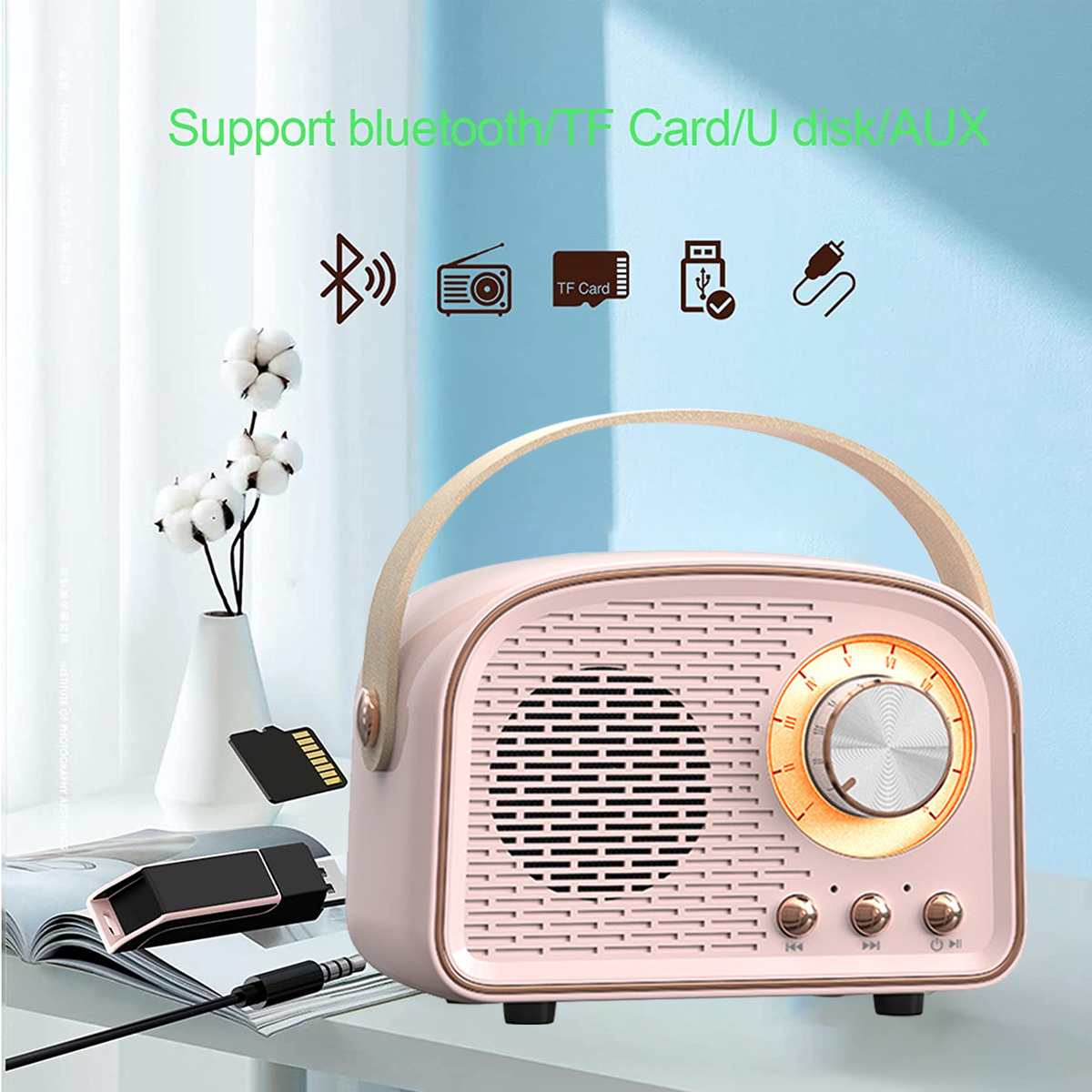 Rosa Radio im Retro-Stil mit Griff, mit Symbolen für Bluetooth, TF-Karte und AUX-Unterstützung.