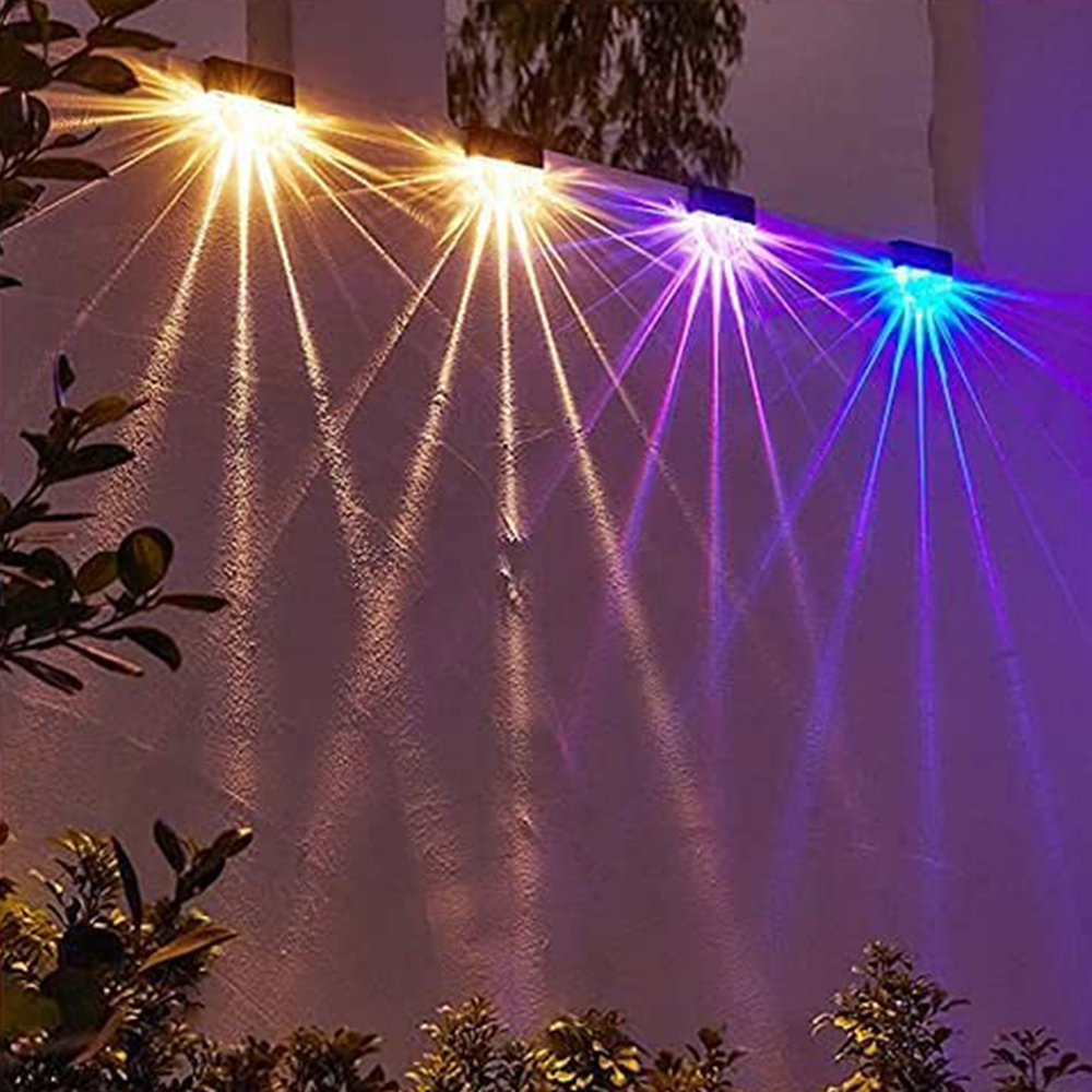 Lichter scheinen auf eine Wand. Verschiedene Farben.