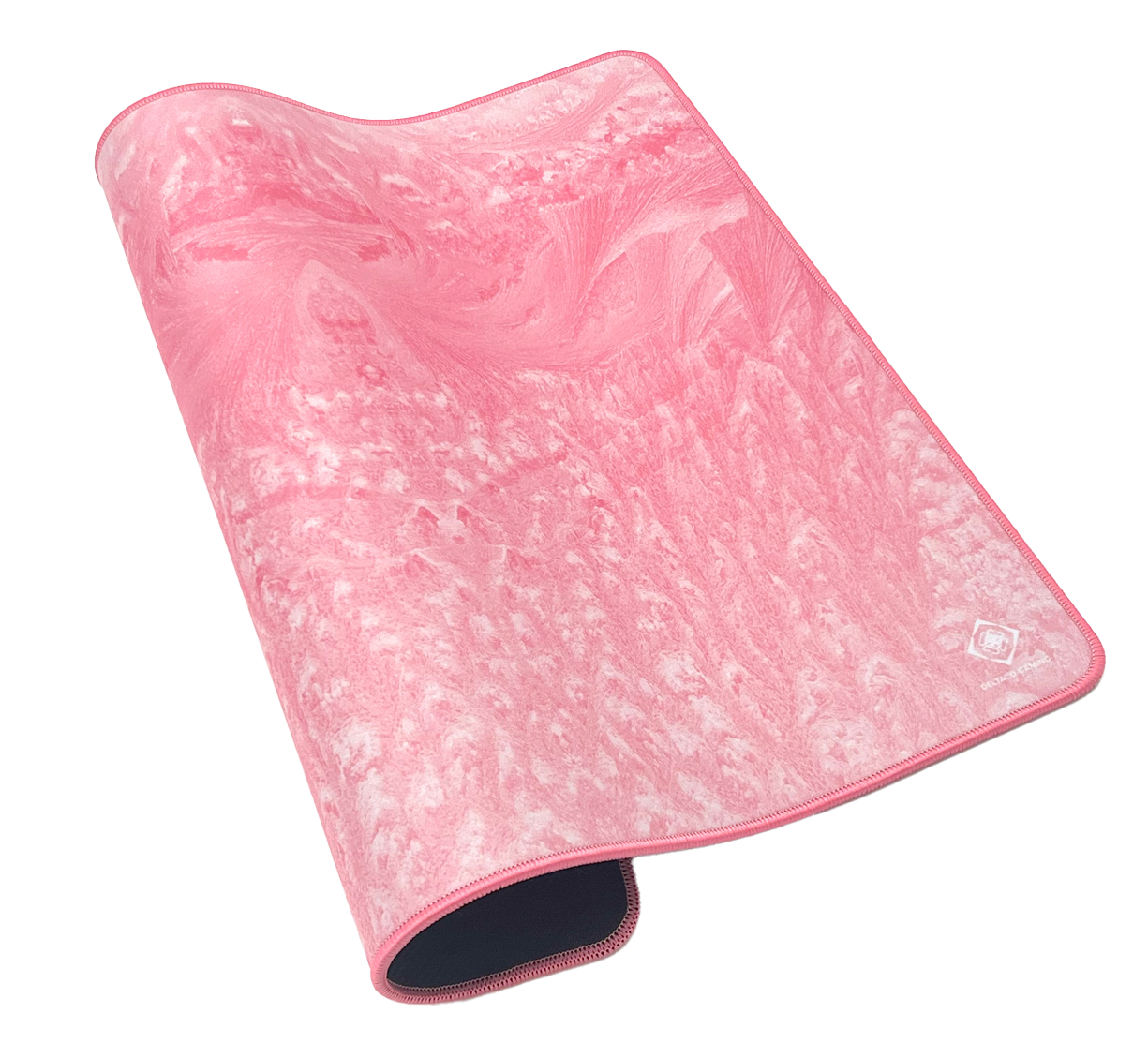 A pink and white marbled mousepad with a dark bottom and a white background.
