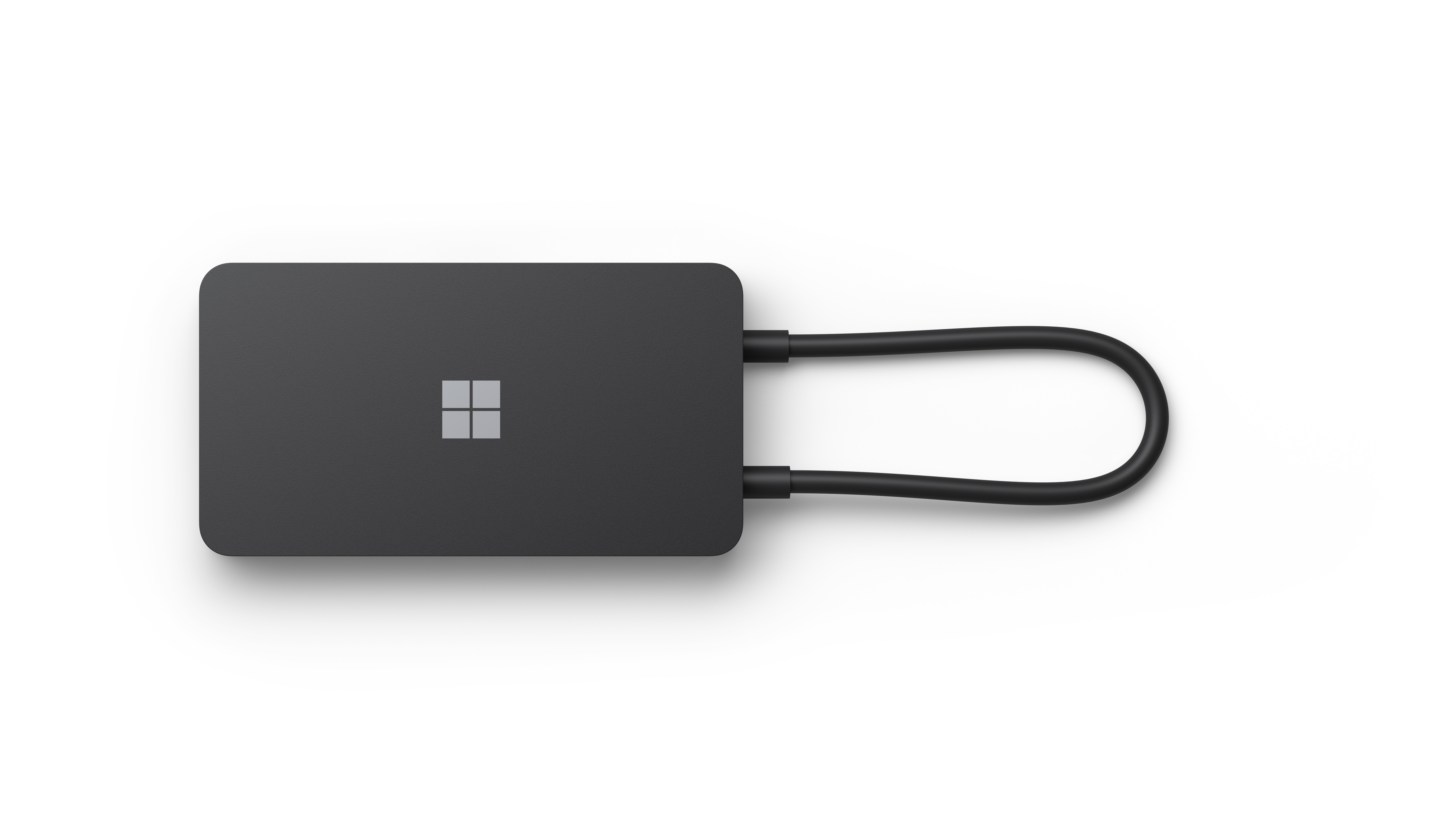 Docking station Microsoft nera con forma quadrata e cavo.