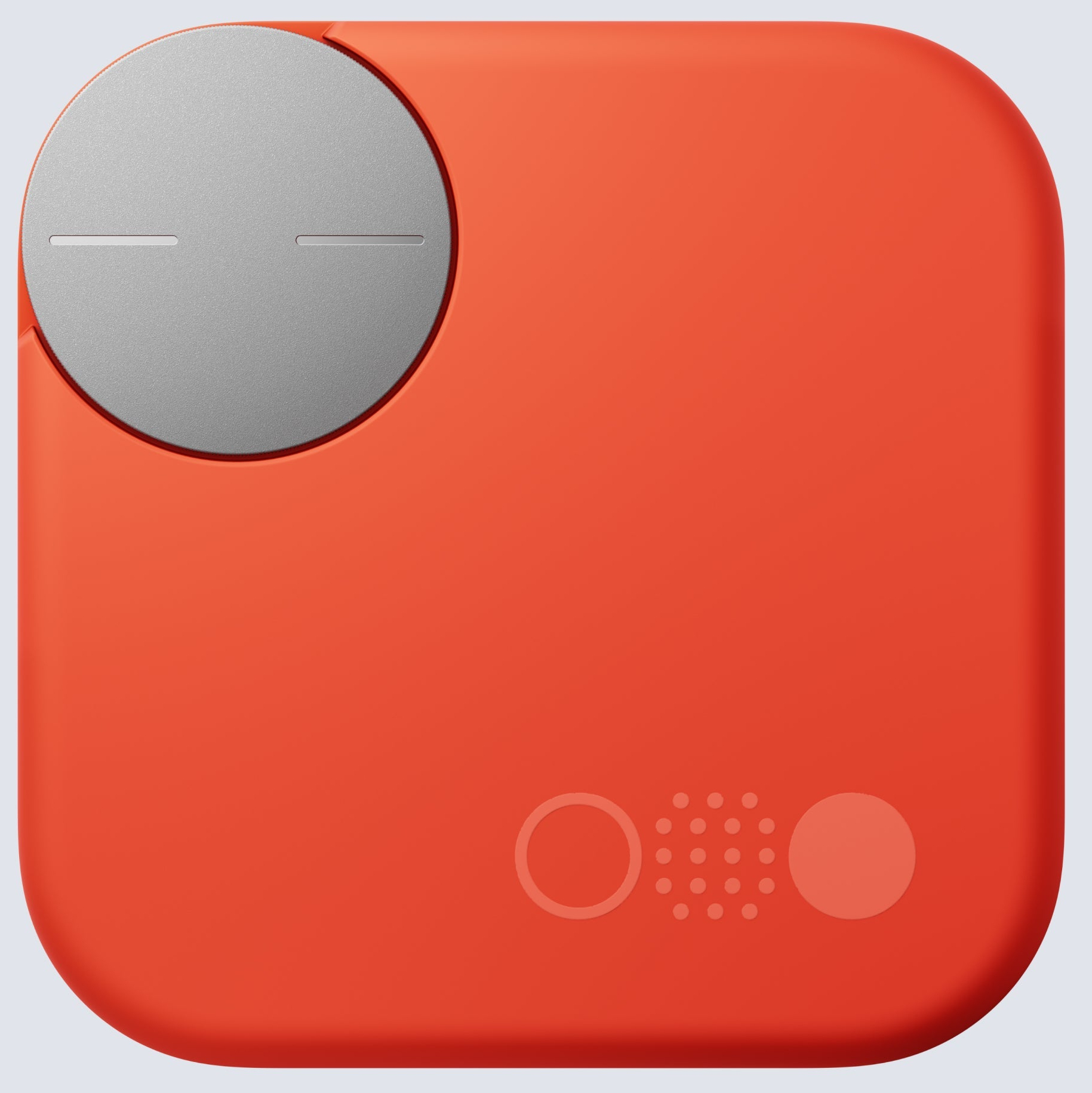 Dispositivo cuadrado naranja con un círculo plateado. Tiene agujeros y líneas.