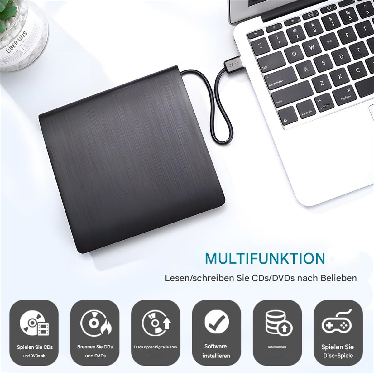 Ein schwarzes CD/DVD-Laufwerk, das an einen Laptop angeschlossen ist, mit Funktionssymbolen.