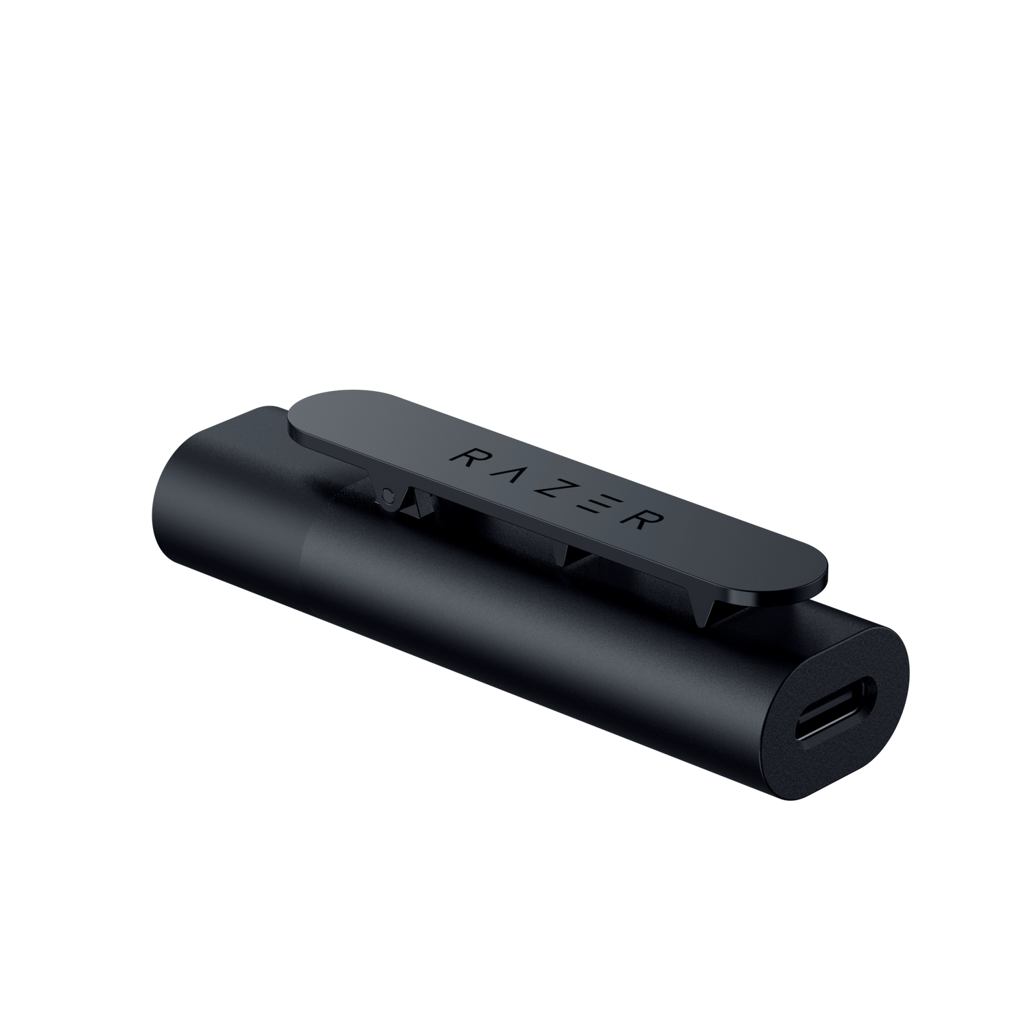 A black Razer charging dock with a clip, seen from an angled perspective on a white surface.
