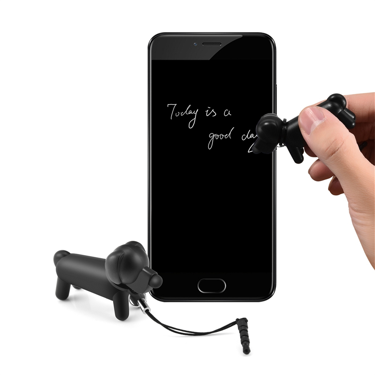 Schwarzes Smartphone mit handschriftlicher Notiz 'Today is a good day' und hundeförmigen Stiften in der Nähe.